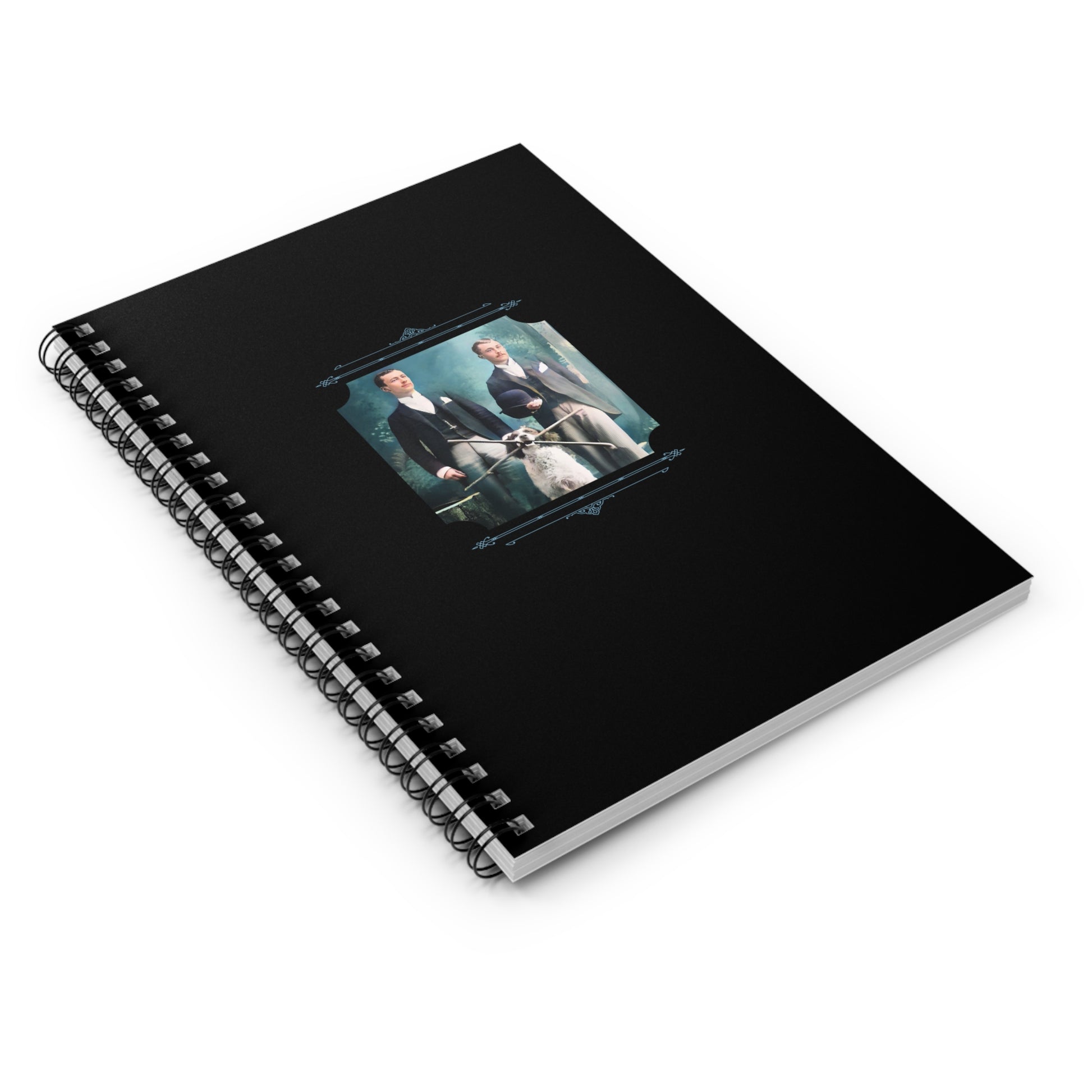 Colorized historical image of two men in formal suits with a dog, seated in a Victorian-era studio, on notebook cover