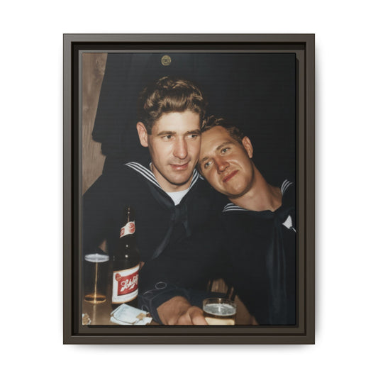 Vintage photograph of two men in navy uniforms leaning together in an indoor social setting