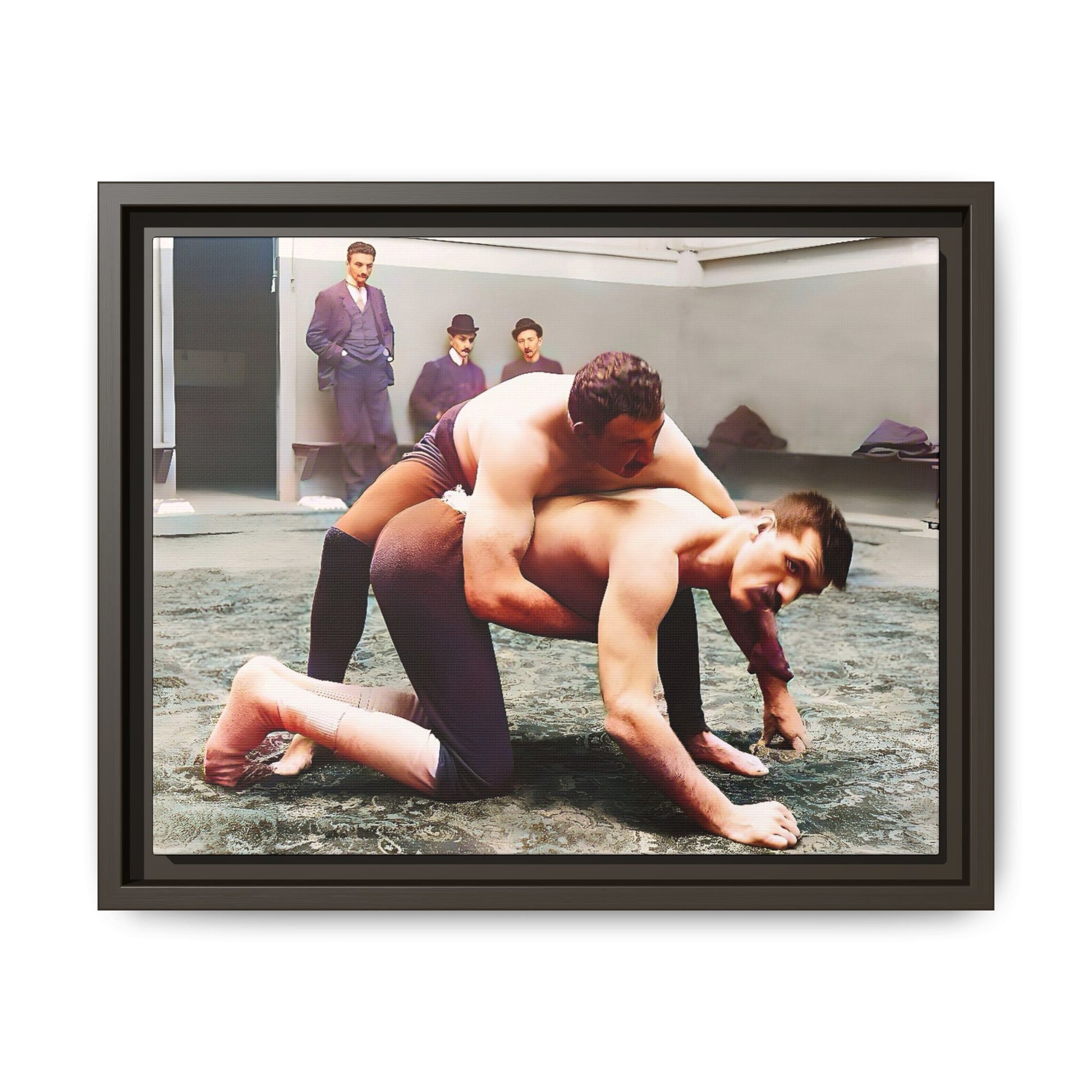 A framed vintage wrestling photograph on matte canvas featuring a Victorian-era match at Love’s Wrestling Club in Plumstead, UK, capturing strength and camaraderie.