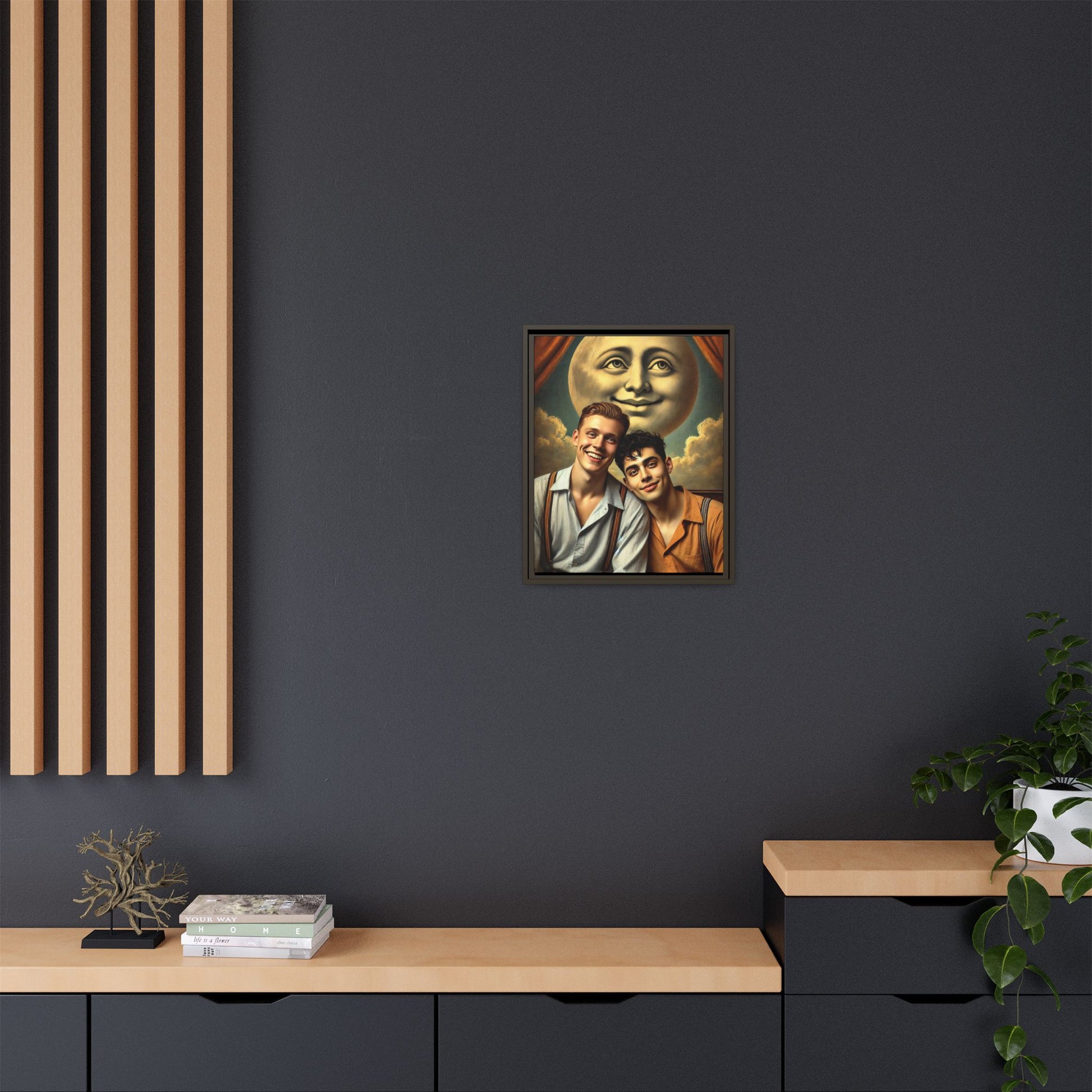 Framed artwork featuring a joyful queer couple in 1930s attire, seated close together beneath a smiling full moon in a theatrical studio setting. A celebration of reclaimed LGBTQ+ narratives in nostalgic portraiture.