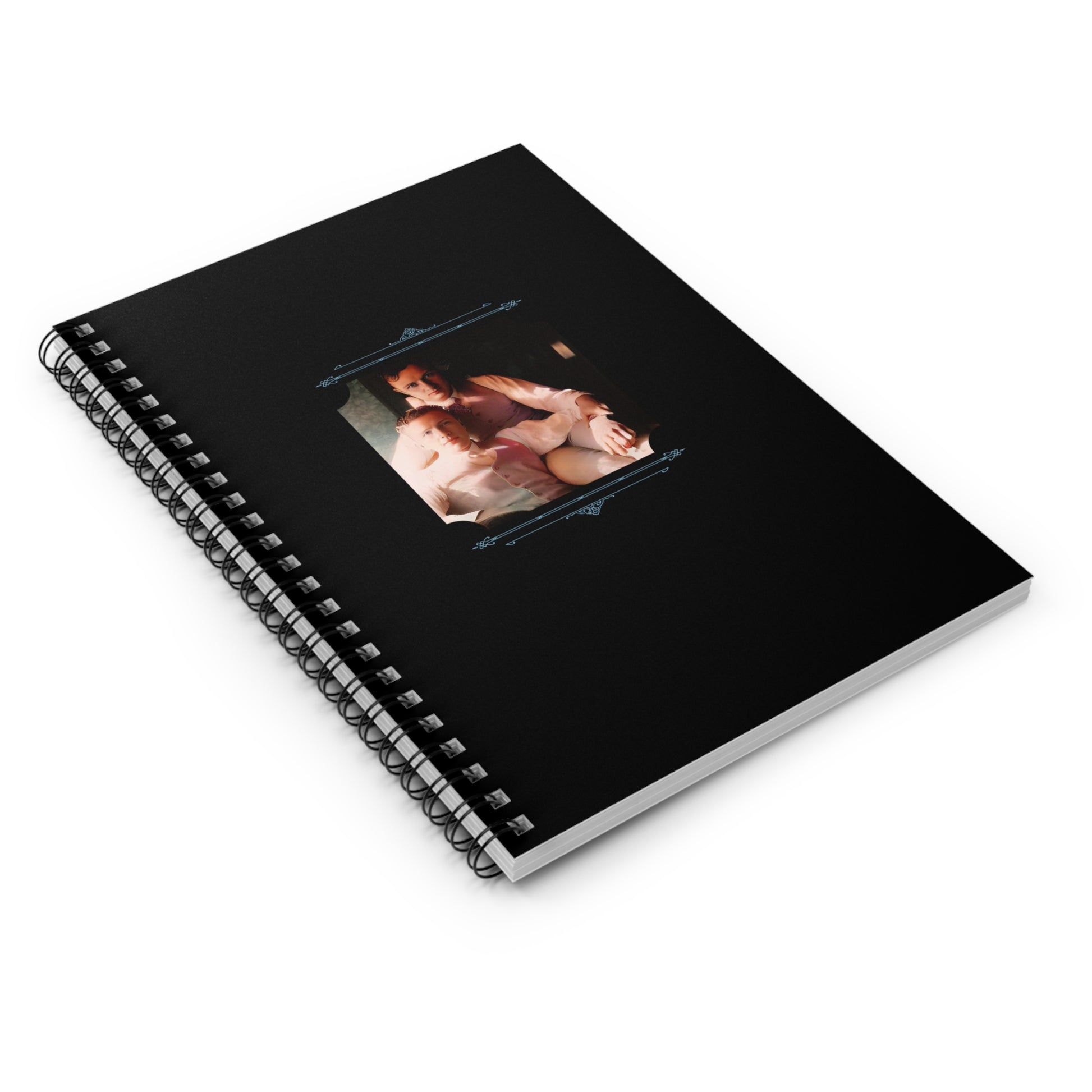 Colorized vintage LGBTQ photo of two men in a tender embrace on a matte black spiral notebook cover