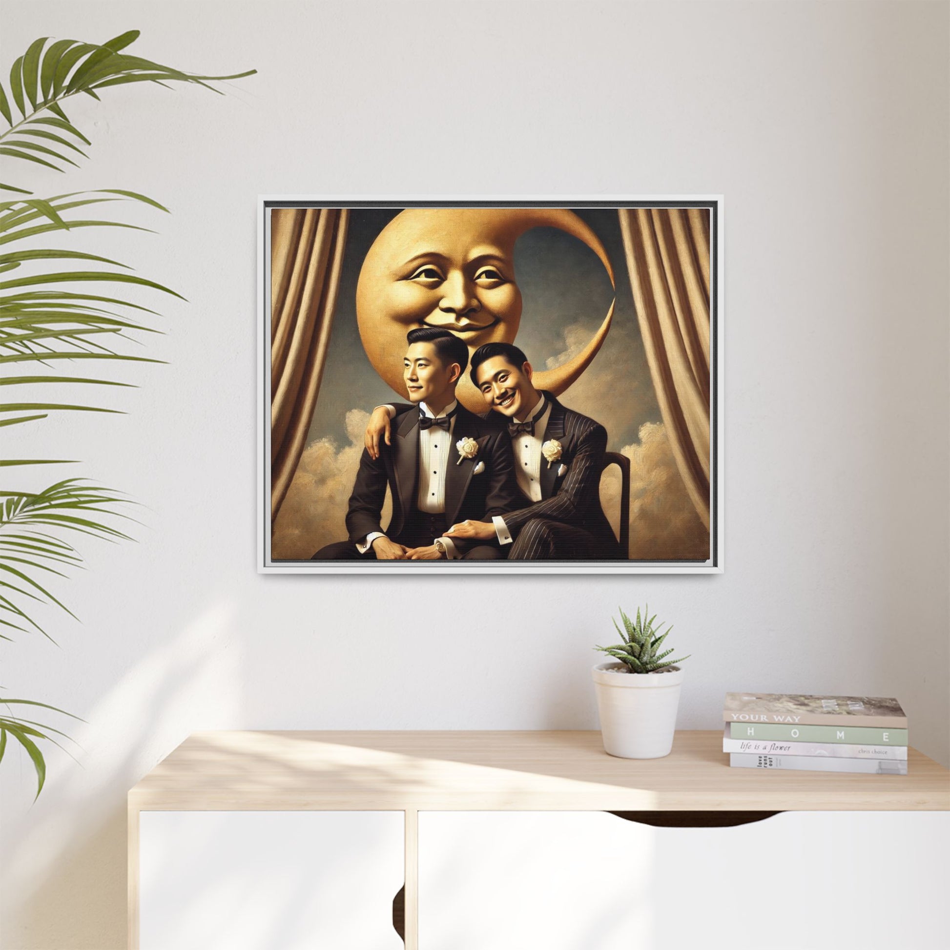 Vintage-inspired artwork of a romantic gay Asian couple in tuxedos sitting affectionately beneath a smiling crescent moon prop, surrounded by vintage stage curtains and dreamy clouds. A reclaimed queer narrative from the Man In The Moon series.