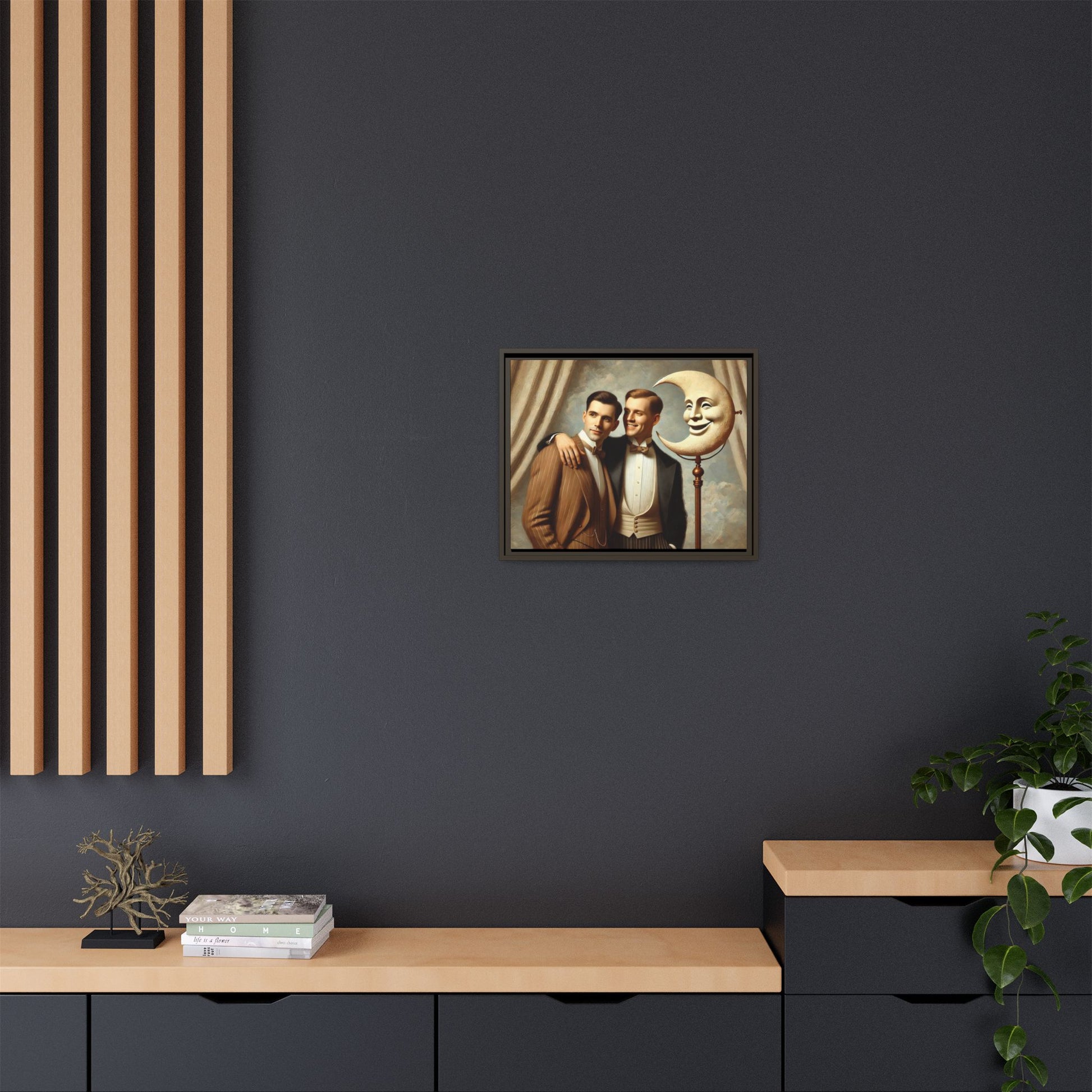Framed matte canvas artwork of two men in vintage tuxedos standing beside a crescent moon prop. This piece reclaims LGBTQ+ representation lost to bias and honors everyday moments of affection and connection once absent from historical archives.