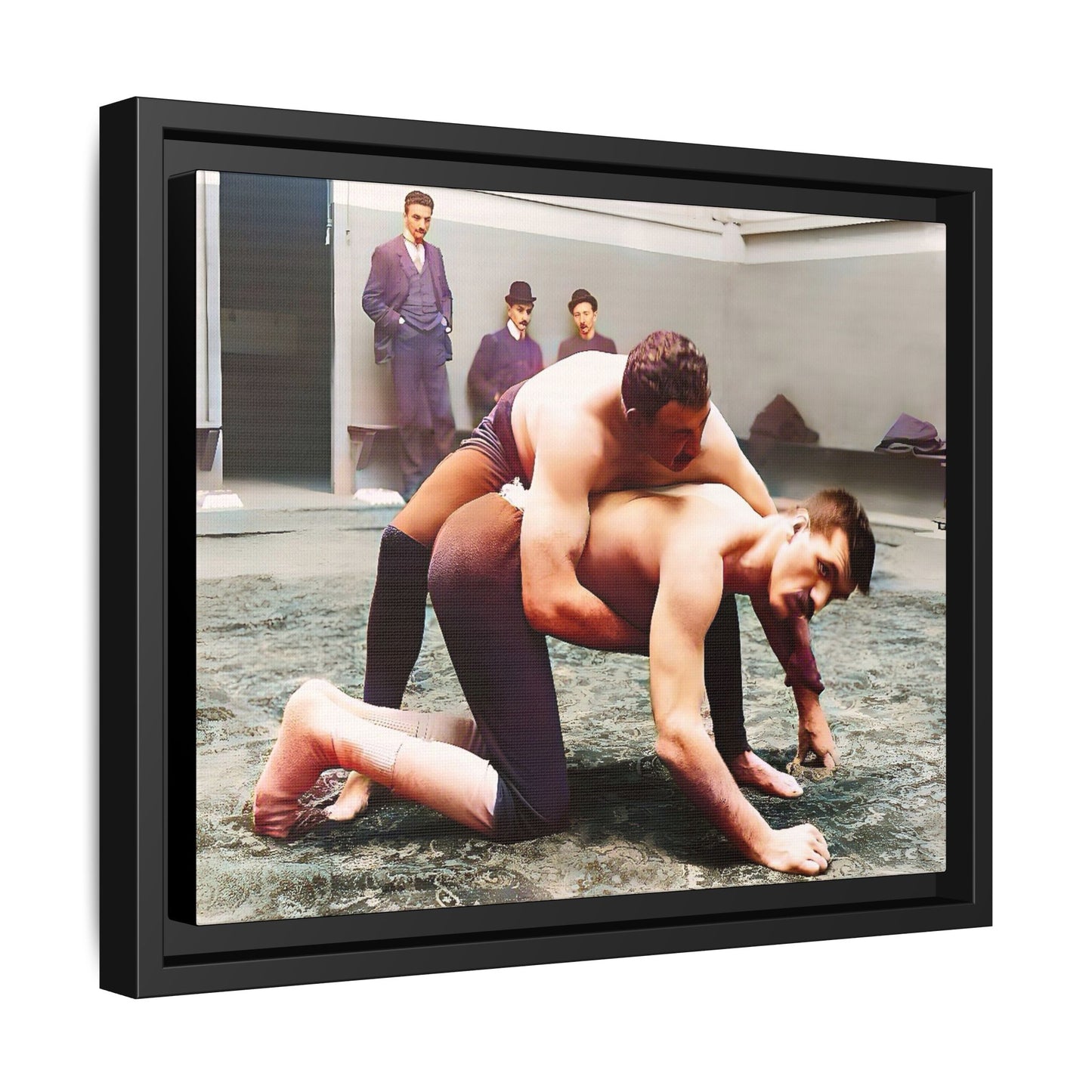 A framed vintage wrestling photograph on matte canvas featuring a Victorian-era match at Love’s Wrestling Club in Plumstead, UK, capturing strength and camaraderie.
