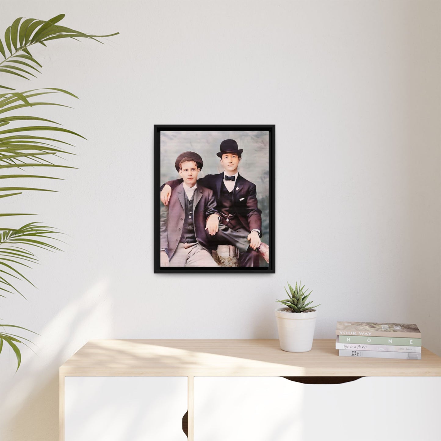 A stunningly restored early 20th-century portrait of Francis and Fai in Santa Barbara, California. Dressed in elegant bowler hats and classic suits, the two men share a poised yet deeply connected moment. The soft pastel tones and refined attire highlight a timeless love story, celebrating LGBTQ+ history and authentic companionship. Gay Couple