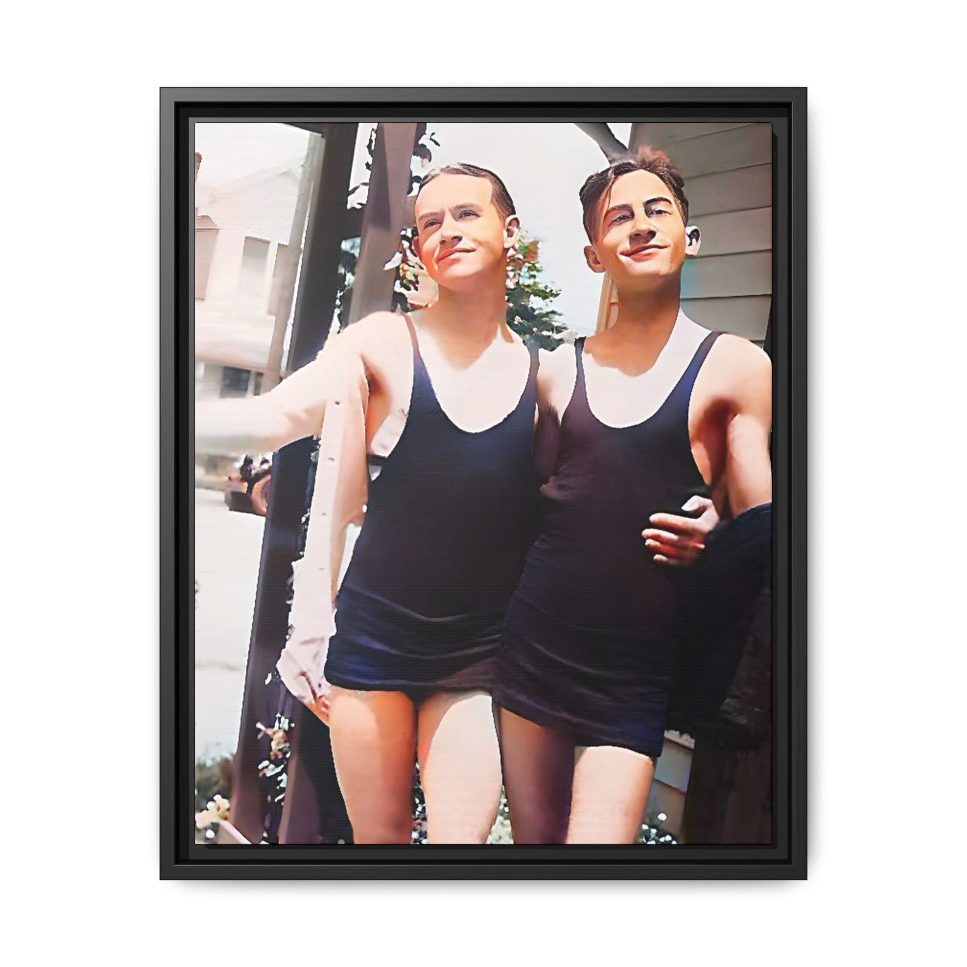 A beautifully restored vintage beach photo of two friends, Lee and Clifford, in classic black swimsuits, walking along Ocean Grove, New Jersey. Their smiles and relaxed body language capture the carefree joy of 1920s summer days, set against a charming coastal backdrop. Gay Couple