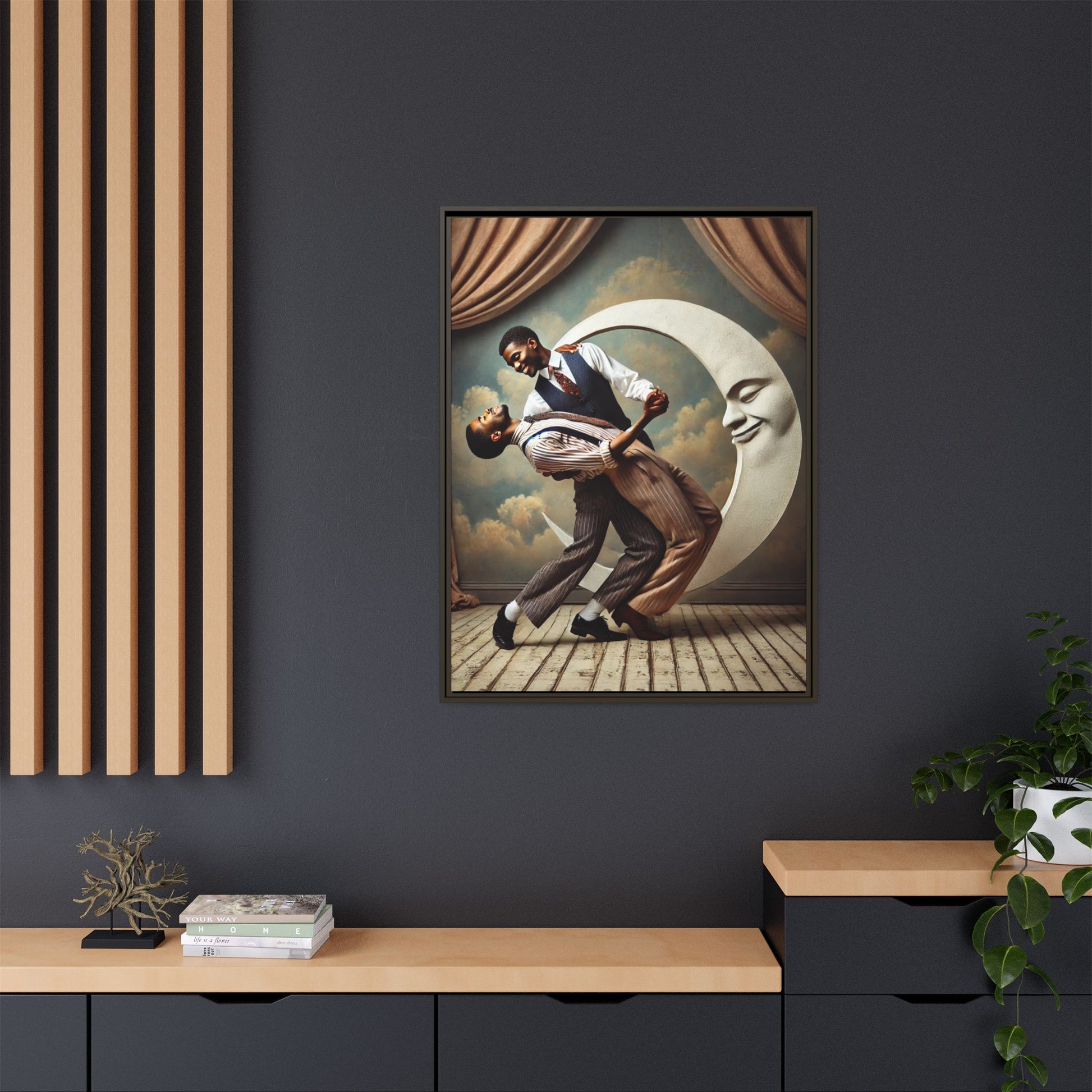 Framed artwork of two Black men in vintage suits dancing tenderly beneath a crescent moon with a smiling face. A romantic 1920s-inspired scene with velvet curtains and a painted sky backdrop. Part of a collection reclaiming lost queer Black history and art.