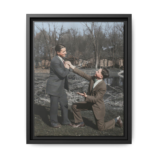 Vintage outdoor portrait of two suited men with one figure kneeling and reaching upward