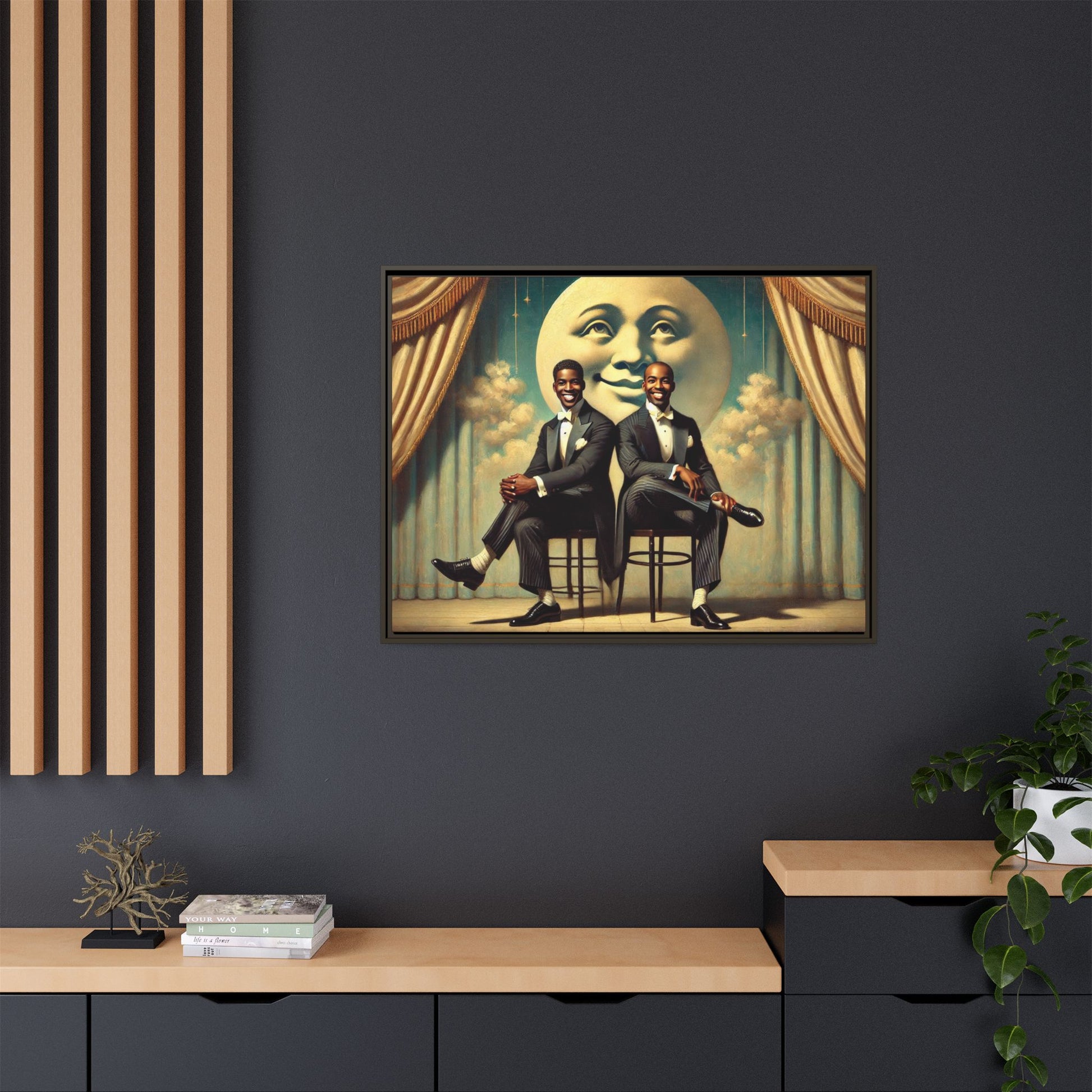 Framed vintage-style portrait of two Black men in tuxedos seated under a smiling crescent moon prop with golden curtains and cloud backdrop. This restored matte canvas honors lost LGBTQ history and reclaims early 20th-century queer representation with pride.