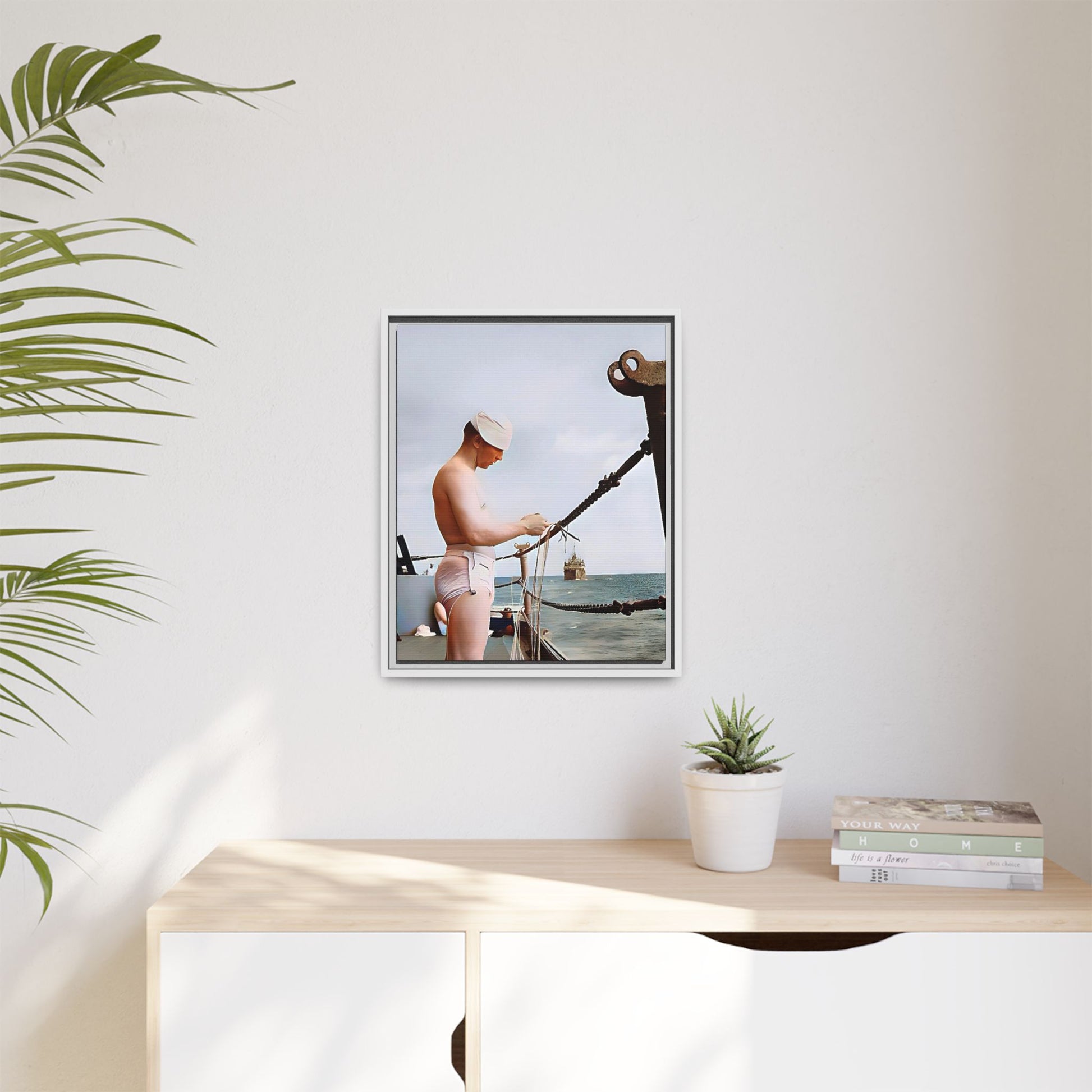 A framed vintage naval portrait on matte canvas featuring a sailor aboard the USS Iowa, honoring maritime history and dedication.