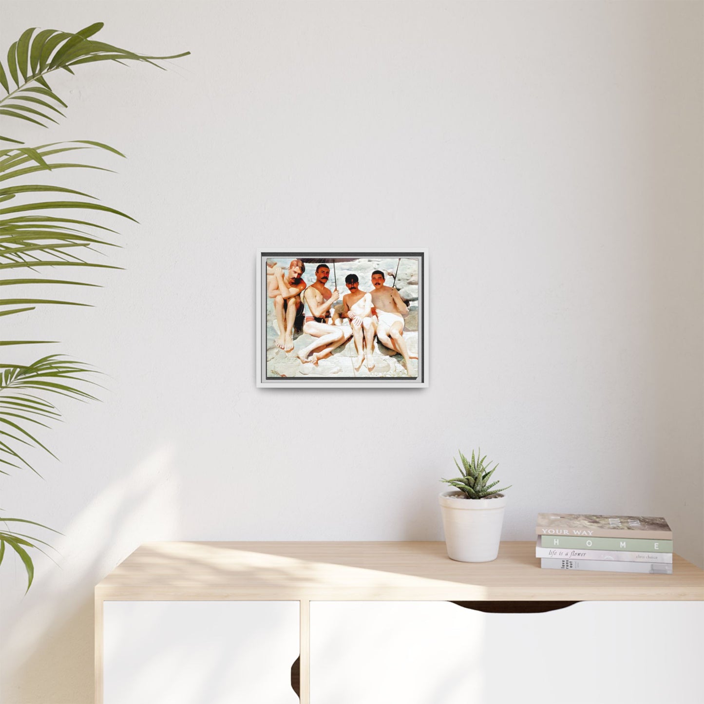 A nostalgic vintage beach photograph from Herring Cove Beach, Provincetown, MA. This framed canvas print captures four men in a relaxed summer moment, perfect for coastal home decor or as an LGBTQ+ history tribute.