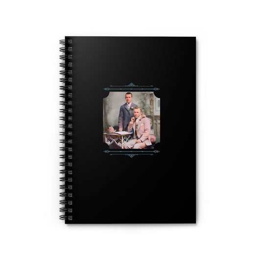 Vintage notebook with a studio portrait of two dapper men in suits, expressing quiet affection and style.