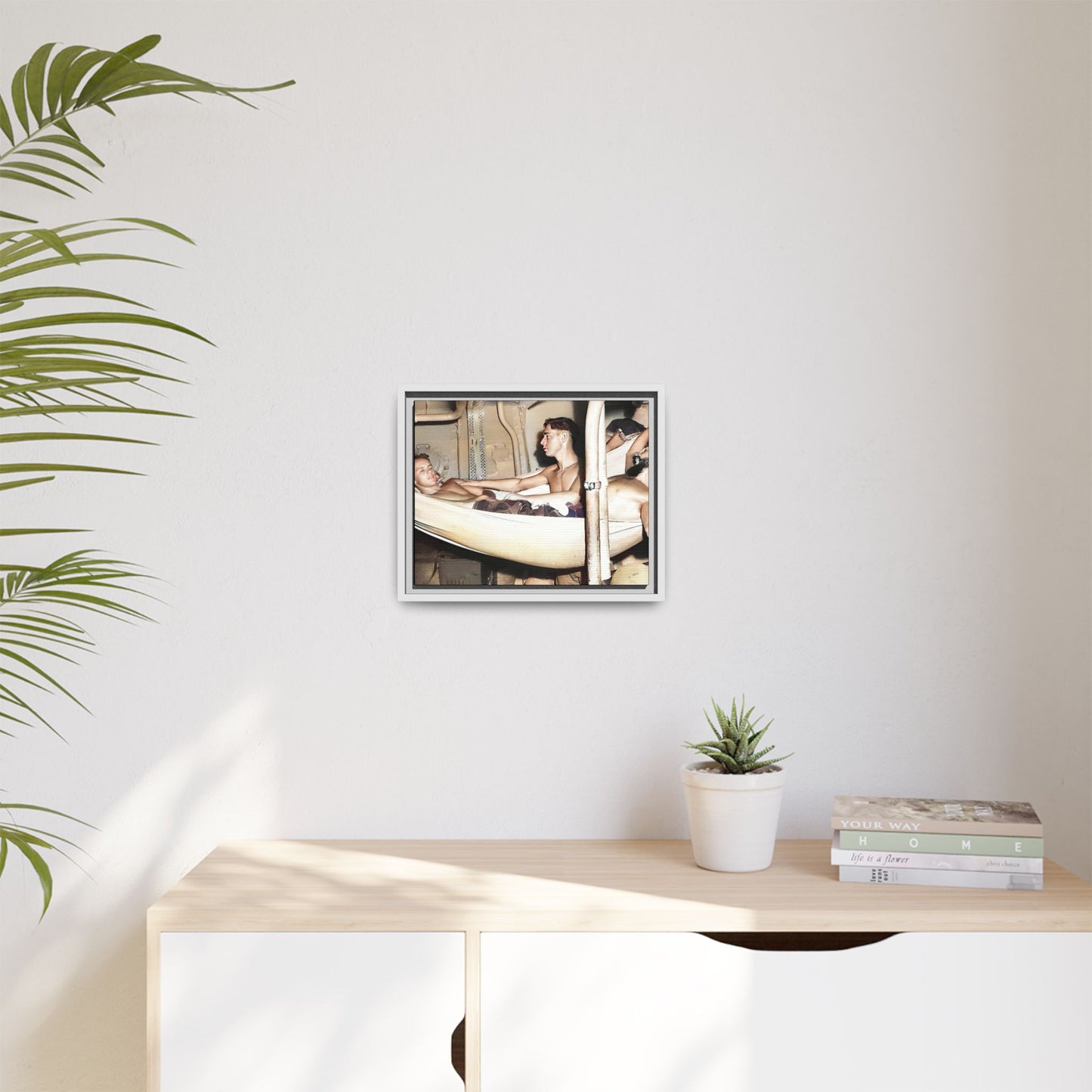 A framed vintage maritime photo on matte canvas featuring sailors aboard the Orleans, capturing life at sea and camaraderie.