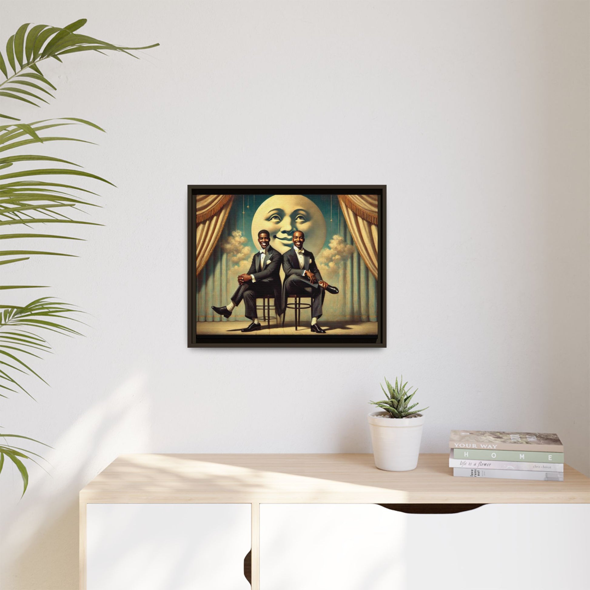 Framed vintage-style portrait of two Black men in tuxedos seated under a smiling crescent moon prop with golden curtains and cloud backdrop. This restored matte canvas honors lost LGBTQ history and reclaims early 20th-century queer representation with pride.