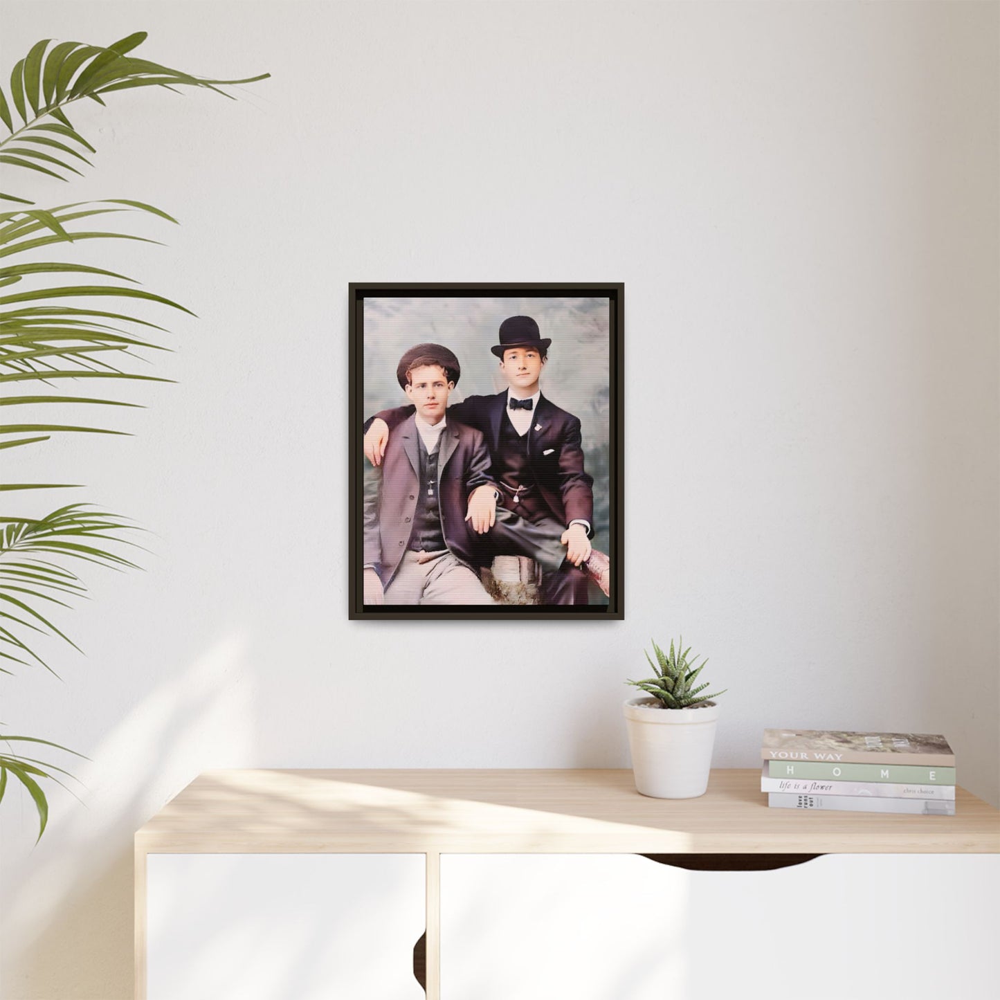 A stunningly restored early 20th-century portrait of Francis and Fai in Santa Barbara, California. Dressed in elegant bowler hats and classic suits, the two men share a poised yet deeply connected moment. The soft pastel tones and refined attire highlight a timeless love story, celebrating LGBTQ+ history and authentic companionship. Gay Couple