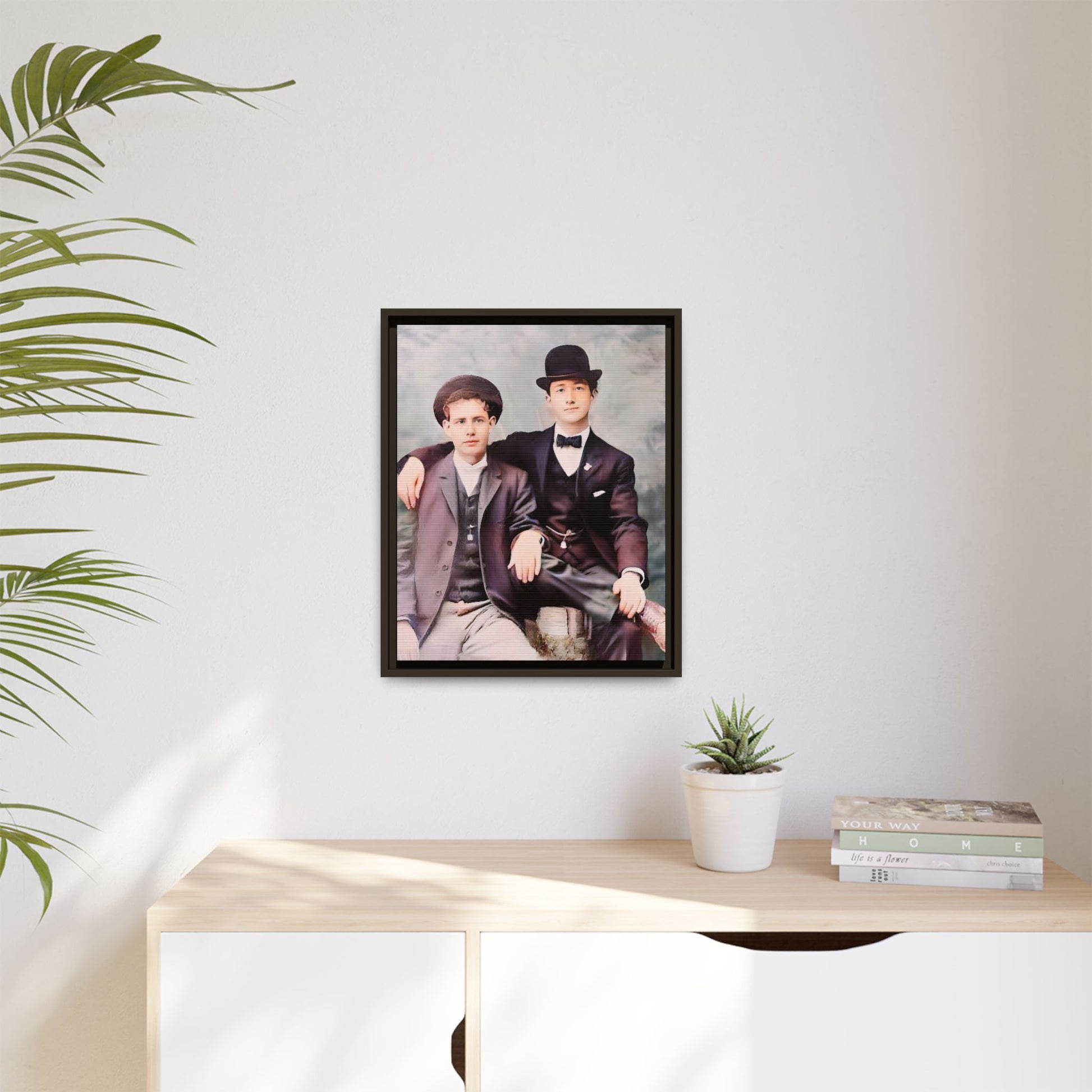 A stunningly restored early 20th-century portrait of Francis and Fai in Santa Barbara, California. Dressed in elegant bowler hats and classic suits, the two men share a poised yet deeply connected moment. The soft pastel tones and refined attire highlight a timeless love story, celebrating LGBTQ+ history and authentic companionship. Gay Couple