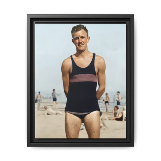 Man standing on beach in vintage striped swimwear early 20th century
