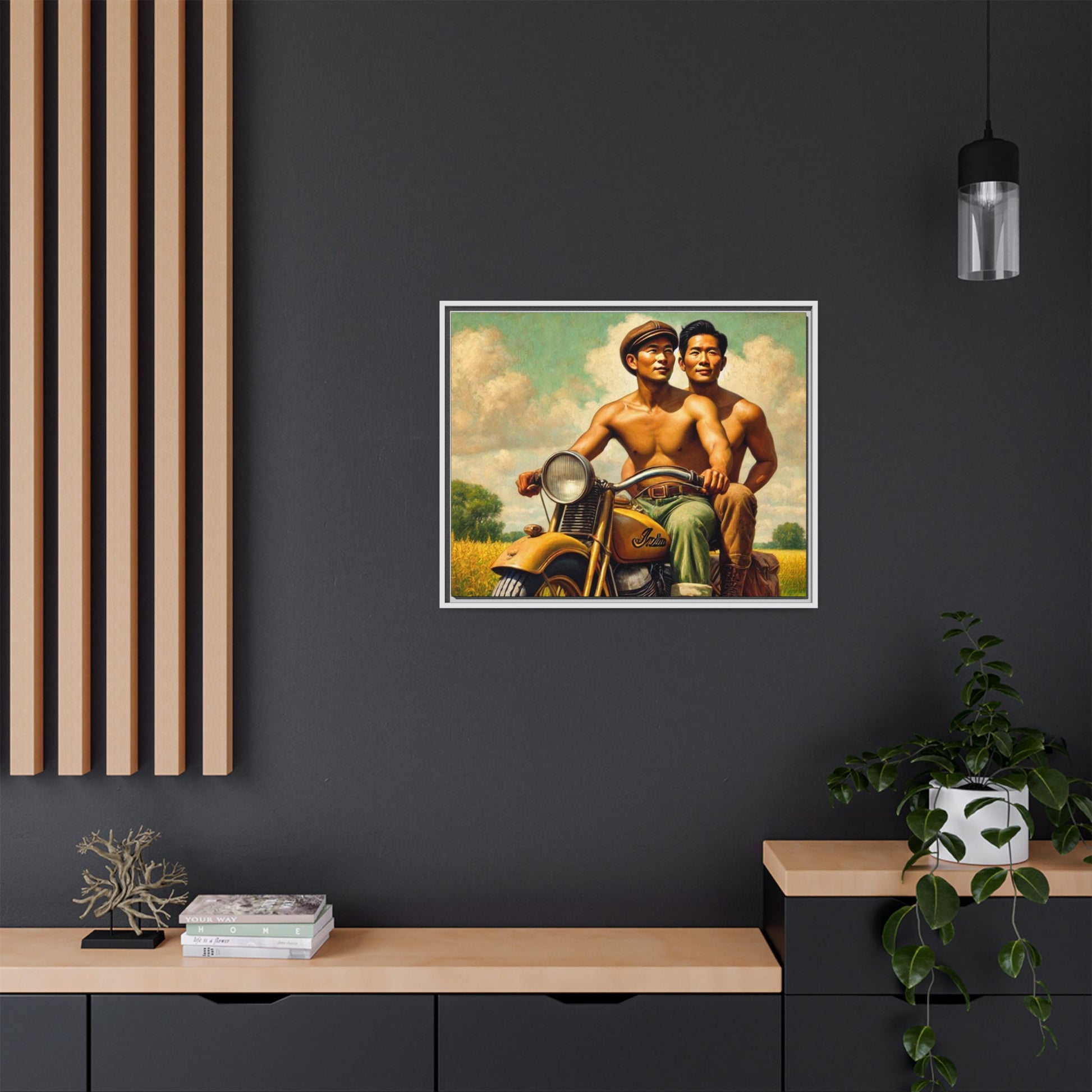 Framed artwork of an Asian-American gay couple riding a vintage yellow motorcycle through Iowa's serene countryside, celebrating love and unity.