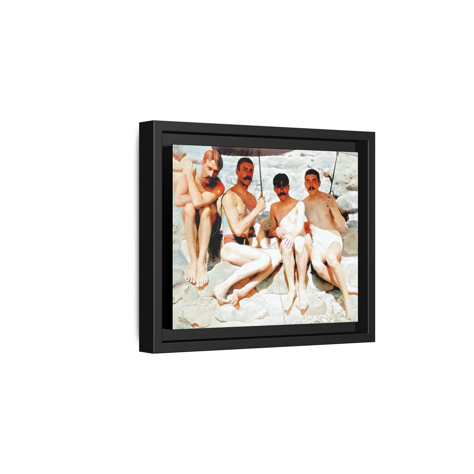 A nostalgic vintage beach photograph from Herring Cove Beach, Provincetown, MA. This framed canvas print captures four men in a relaxed summer moment, perfect for coastal home decor or as an LGBTQ+ history tribute.