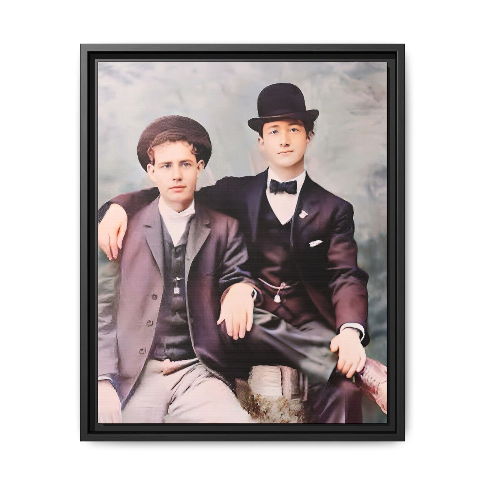 A stunningly restored early 20th-century portrait of Francis and Fai in Santa Barbara, California. Dressed in elegant bowler hats and classic suits, the two men share a poised yet deeply connected moment. The soft pastel tones and refined attire highlight a timeless love story, celebrating LGBTQ+ history and authentic companionship. Gay Couple
