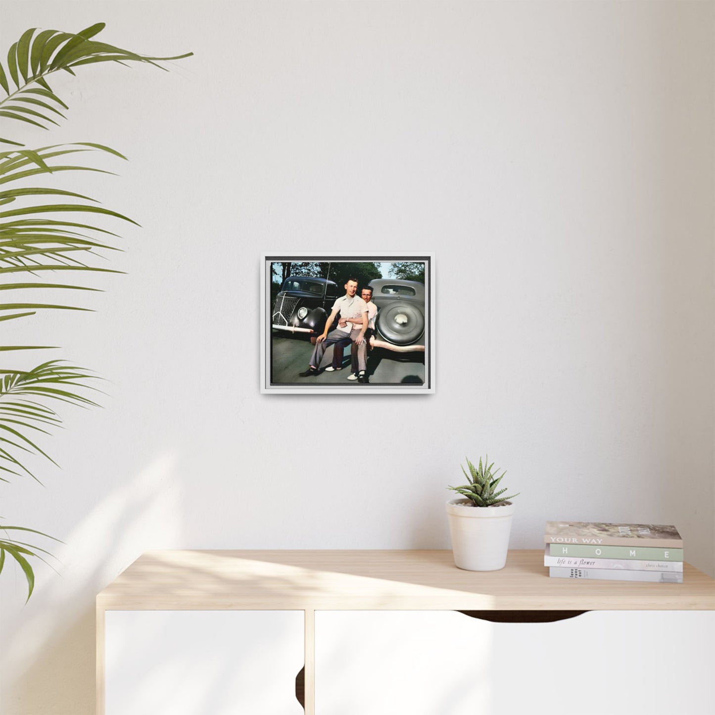 Restored vintage photograph of Andrew and Eugene seated on a classic car bumper in 1930s Lincoln, Nebraska. Framed matte canvas print celebrating LGBTQ+ history, love, and timeless companionship. Gay Couple