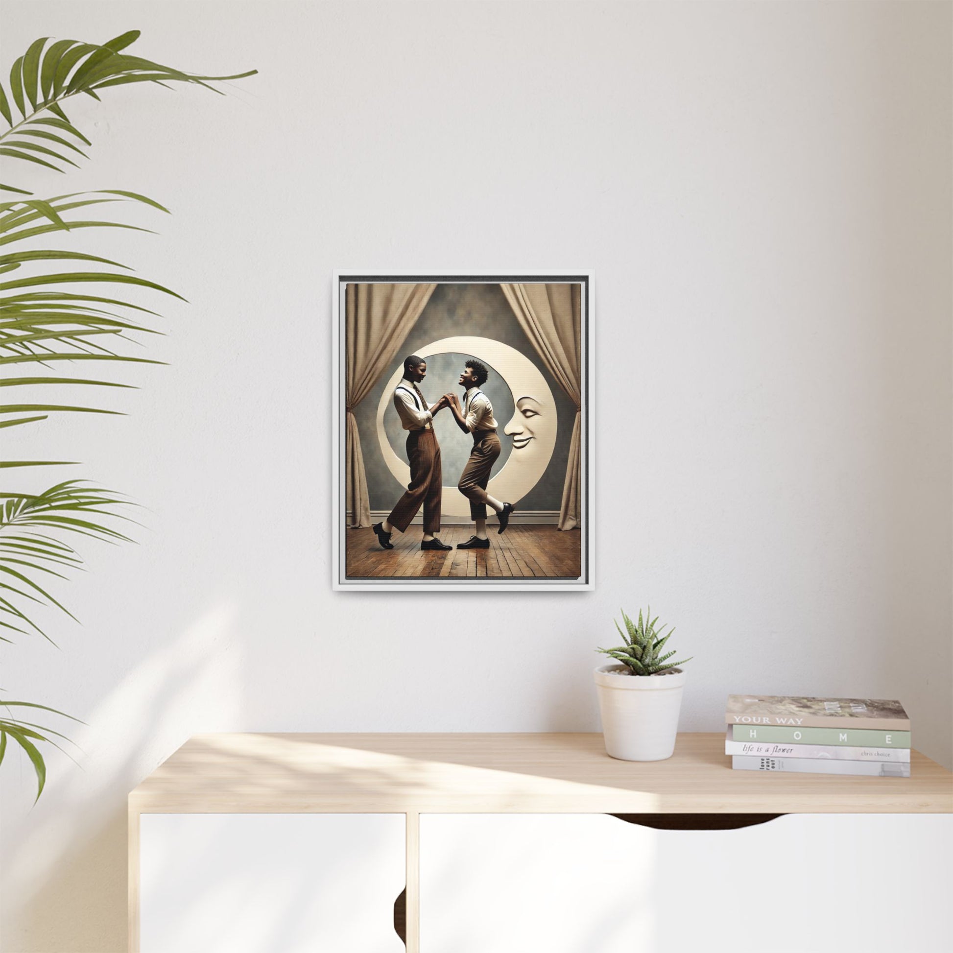 Two joyful young Black men dressed in 1920s fashion dancing in front of a crescent moon prop with a smiling face. This artwork reclaims erased queer love, offering a whimsical and powerful celebration of Black LGBTQ+ youth and history.