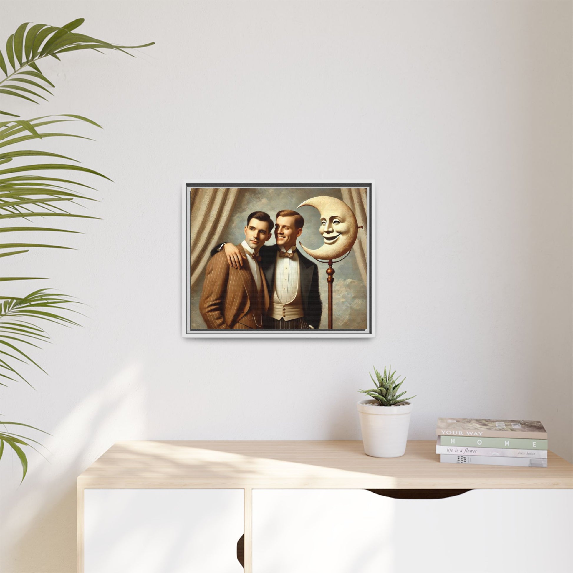 Framed matte canvas artwork of two men in vintage tuxedos standing beside a crescent moon prop. This piece reclaims LGBTQ+ representation lost to bias and honors everyday moments of affection and connection once absent from historical archives.