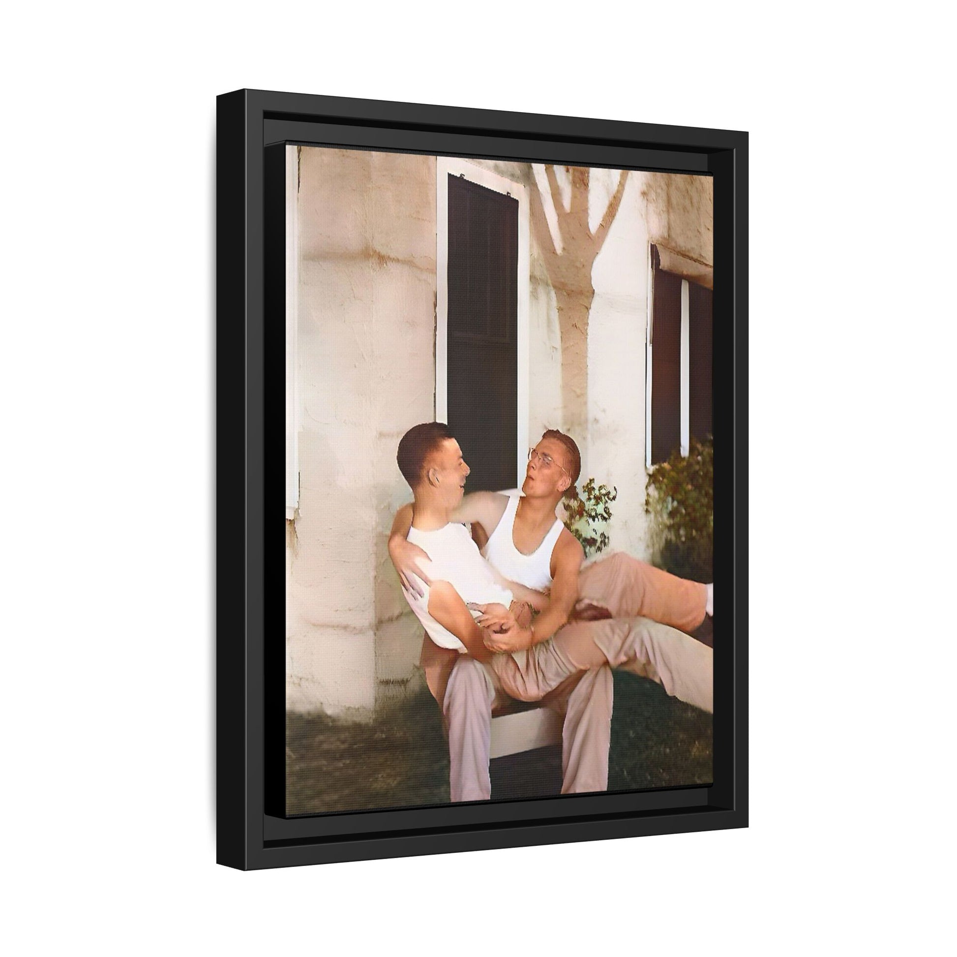 A vintage photograph of Donald and Joseph, two men embracing with joy in 1930s New Orleans. Captured in warm sunlight against a rustic Louisiana home, this intimate portrait celebrates LGBTQ+ history, love, and the beauty of unspoken connection. Gay Couple