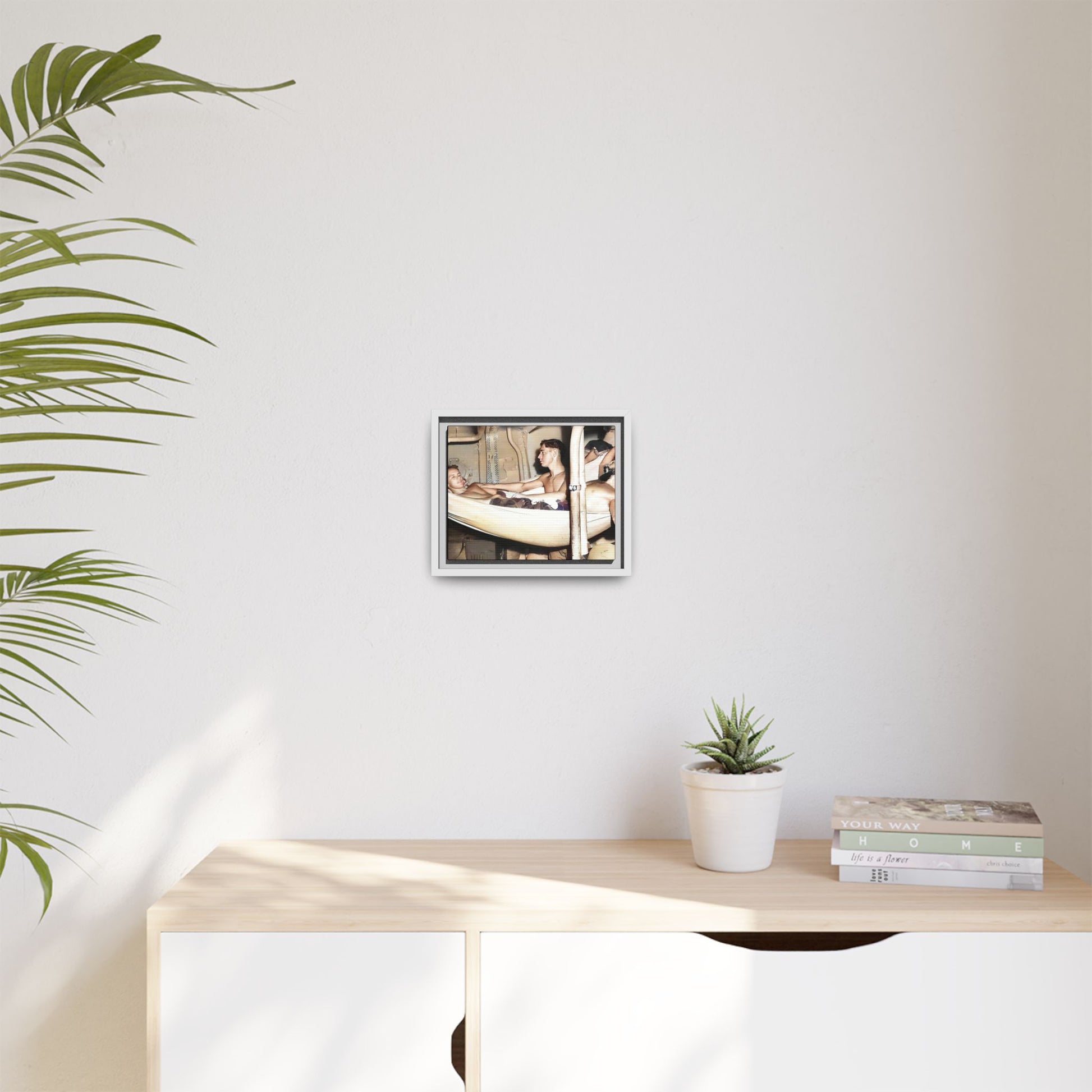 A framed vintage maritime photo on matte canvas featuring sailors aboard the Orleans, capturing life at sea and camaraderie.