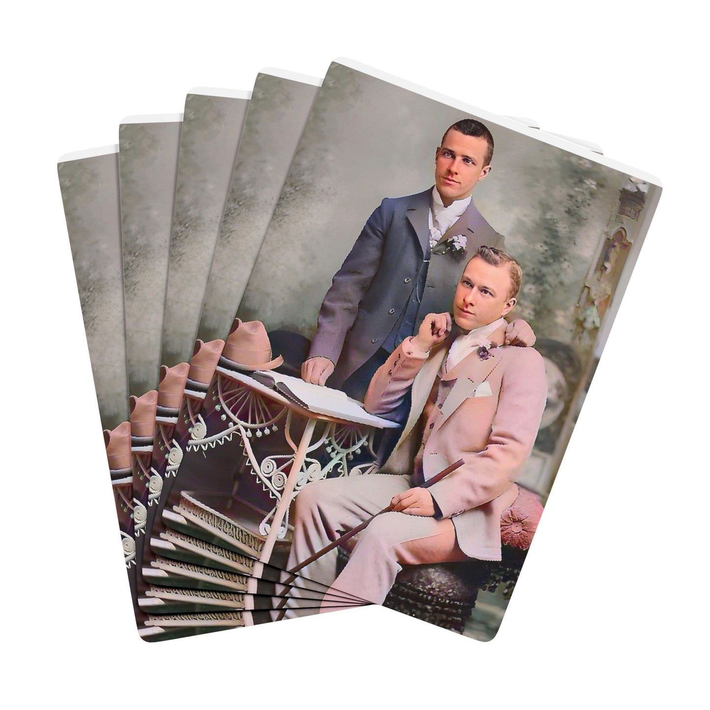 Vintage photo of an elegantly dressed gay couple in a formal studio setting, symbolizing Queer love and resilience.