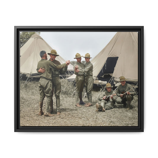 Hommes 006 framed matte canvas showing men in campaign hats dancing beside musicians at a tented military camp.