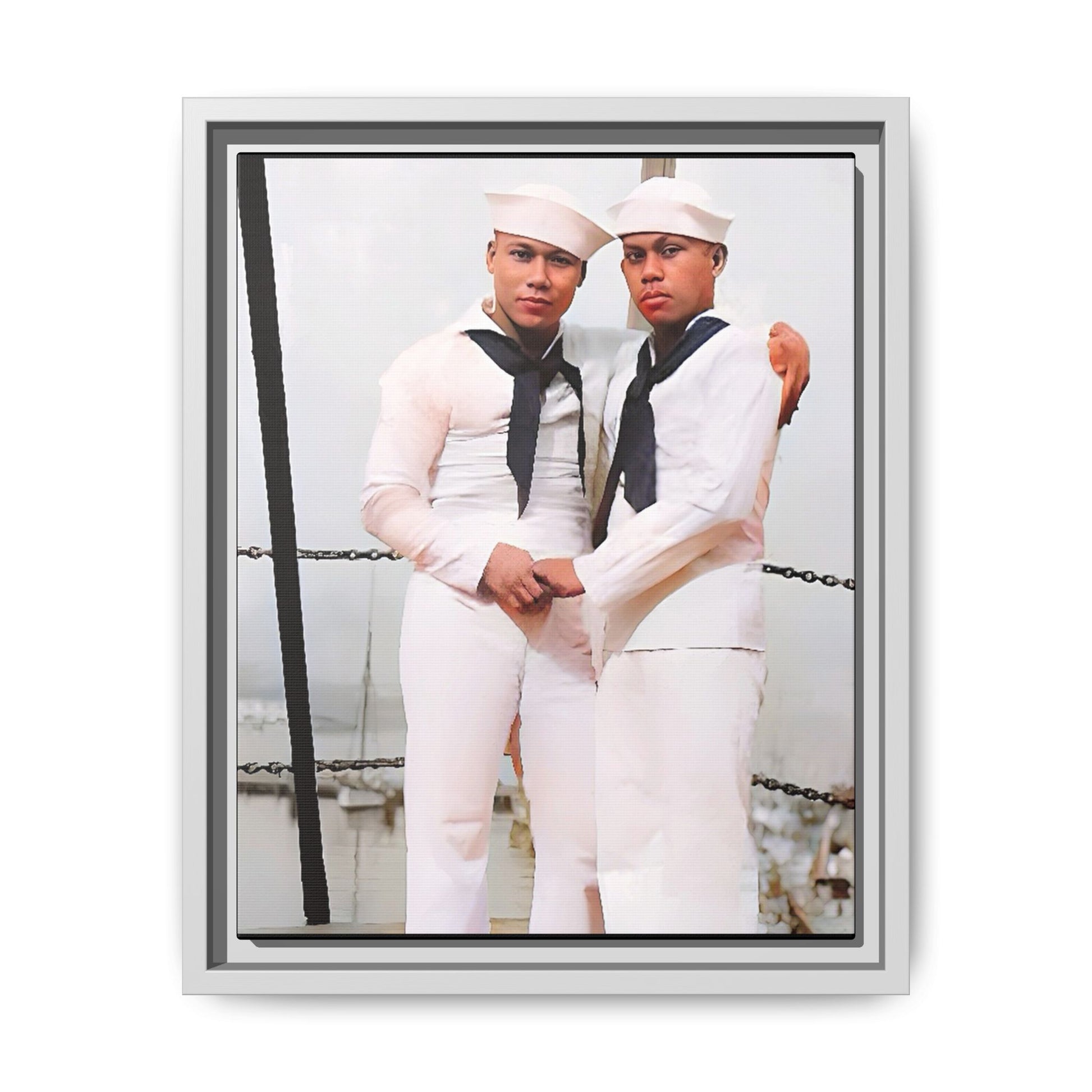 A restored vintage photograph of two Navy sailors standing together aboard a naval ship at Apra Harbor, Guam. Dressed in crisp white uniforms, their hands gently clasped, the image captures a quiet moment of strength, devotion, and LGBTQ+ military history.
