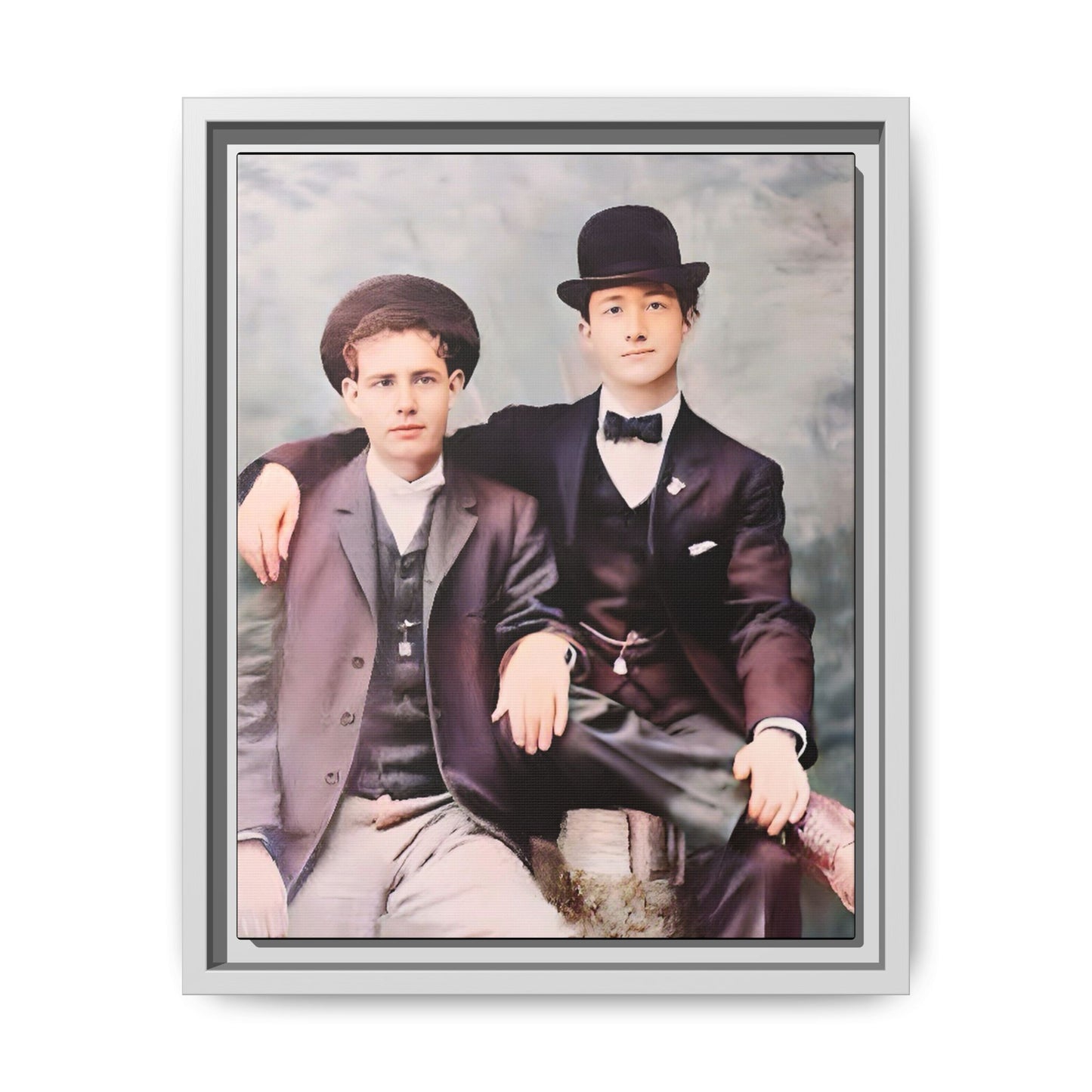 A stunningly restored early 20th-century portrait of Francis and Fai in Santa Barbara, California. Dressed in elegant bowler hats and classic suits, the two men share a poised yet deeply connected moment. The soft pastel tones and refined attire highlight a timeless love story, celebrating LGBTQ+ history and authentic companionship. Gay Couple