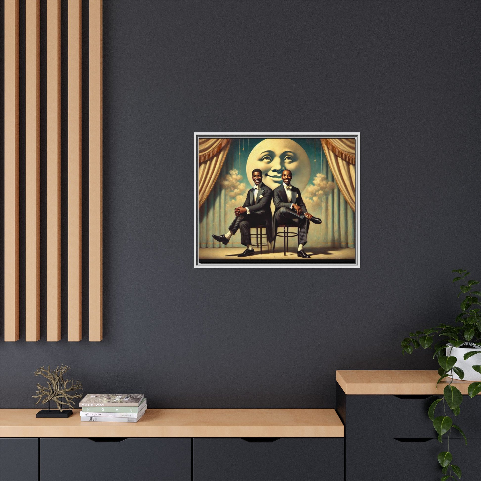 Framed vintage-style portrait of two Black men in tuxedos seated under a smiling crescent moon prop with golden curtains and cloud backdrop. This restored matte canvas honors lost LGBTQ history and reclaims early 20th-century queer representation with pride.