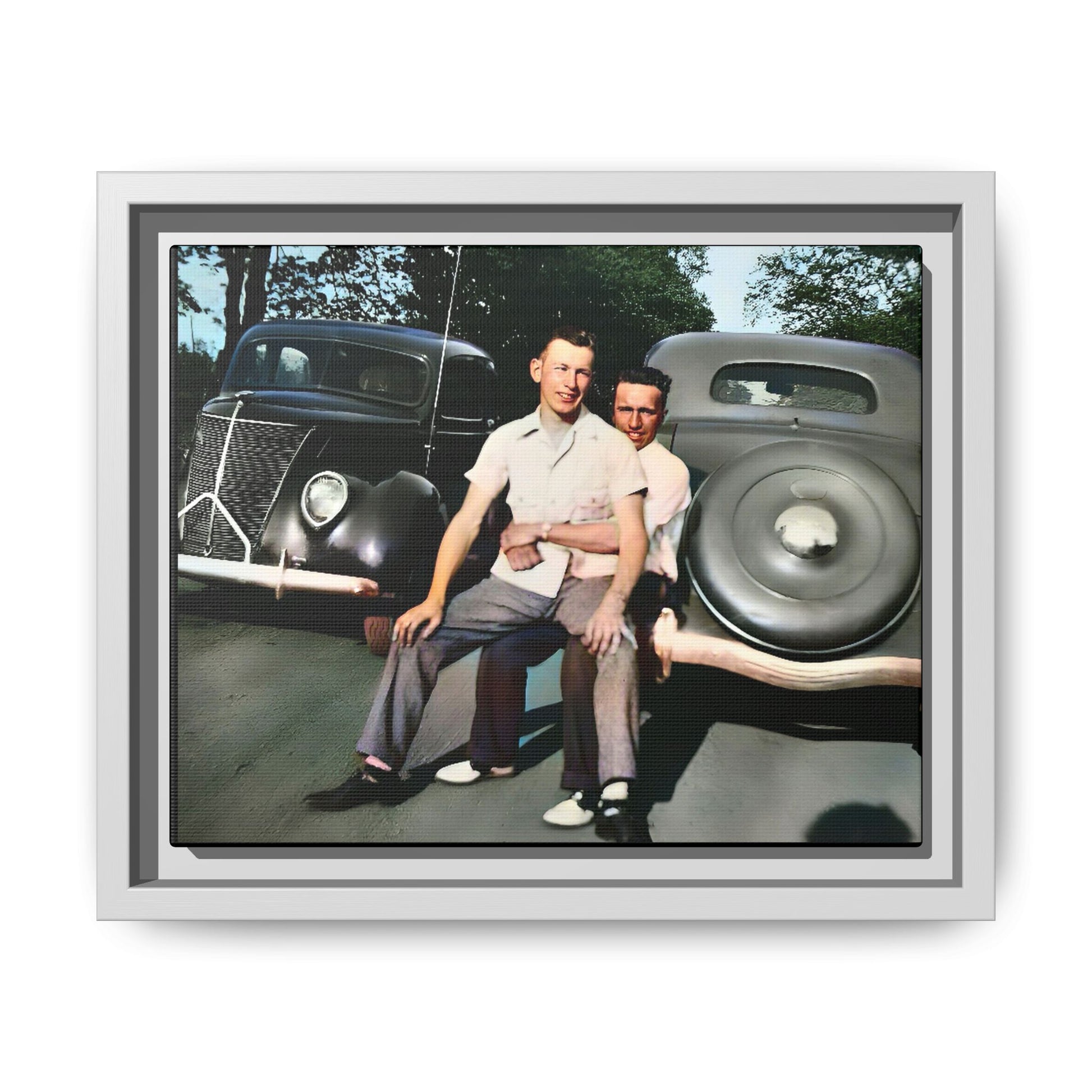 Restored vintage photograph of Andrew and Eugene seated on a classic car bumper in 1930s Lincoln, Nebraska. Framed matte canvas print celebrating LGBTQ+ history, love, and timeless companionship. Gay Couple