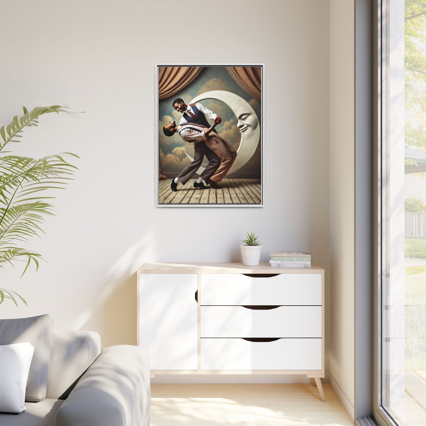 Framed artwork of two Black men in vintage suits dancing tenderly beneath a crescent moon with a smiling face. A romantic 1920s-inspired scene with velvet curtains and a painted sky backdrop. Part of a collection reclaiming lost queer Black history and art.