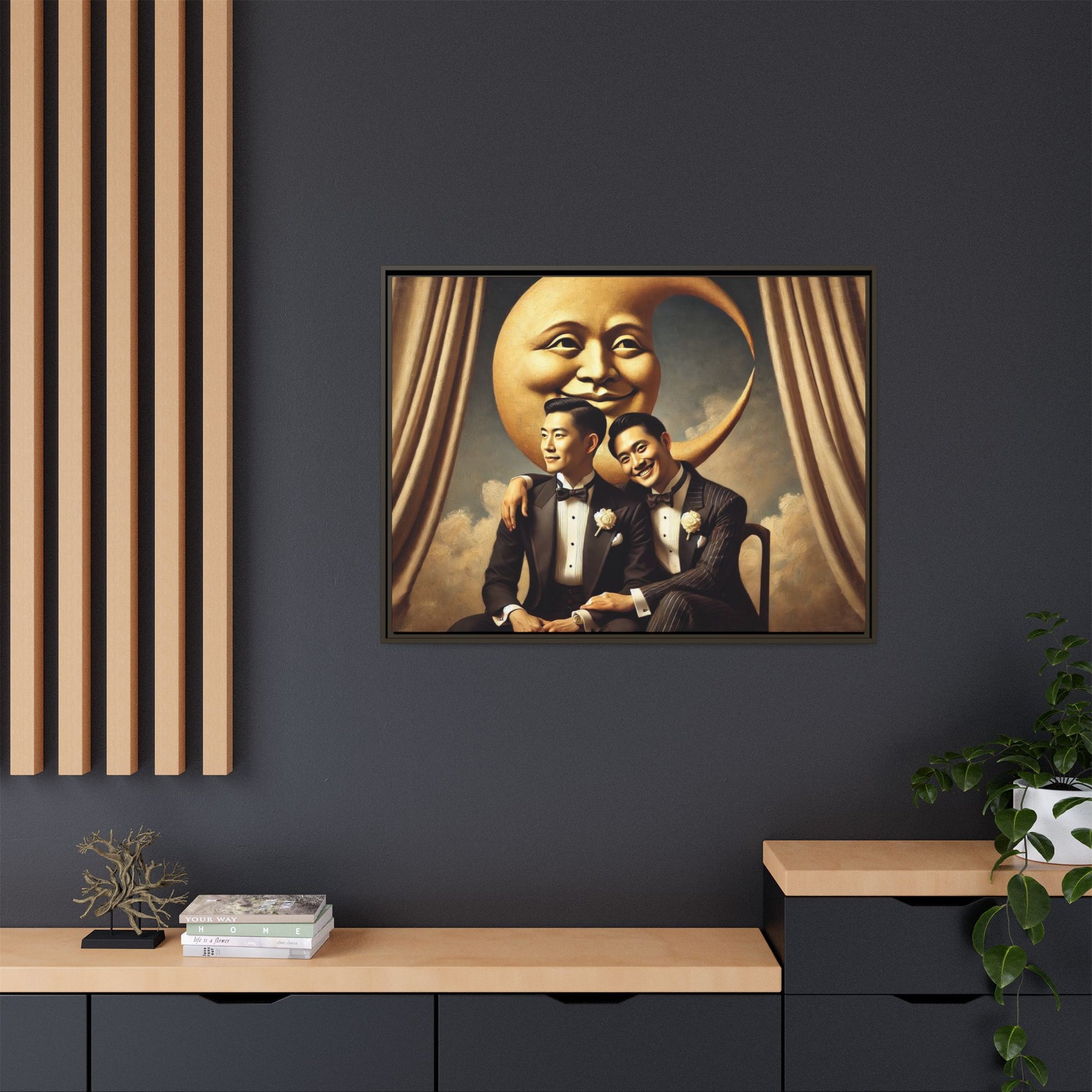 Vintage-inspired artwork of a romantic gay Asian couple in tuxedos sitting affectionately beneath a smiling crescent moon prop, surrounded by vintage stage curtains and dreamy clouds. A reclaimed queer narrative from the Man In The Moon series.