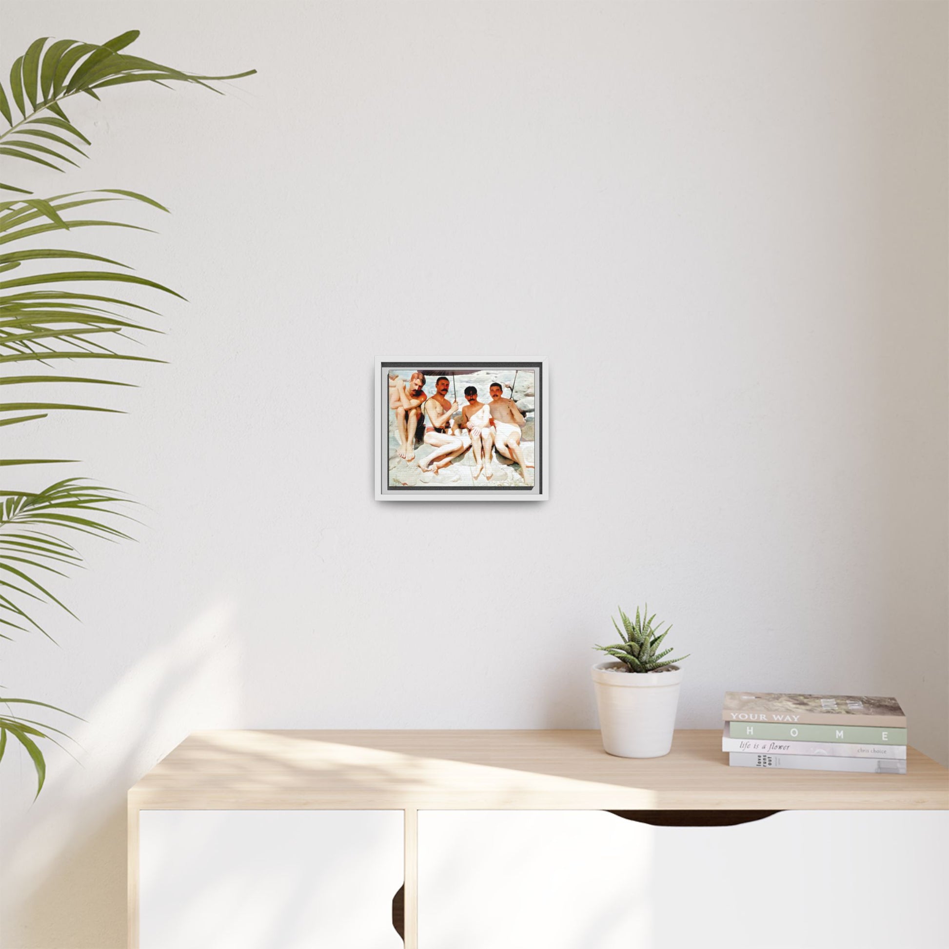 A nostalgic vintage beach photograph from Herring Cove Beach, Provincetown, MA. This framed canvas print captures four men in a relaxed summer moment, perfect for coastal home decor or as an LGBTQ+ history tribute.