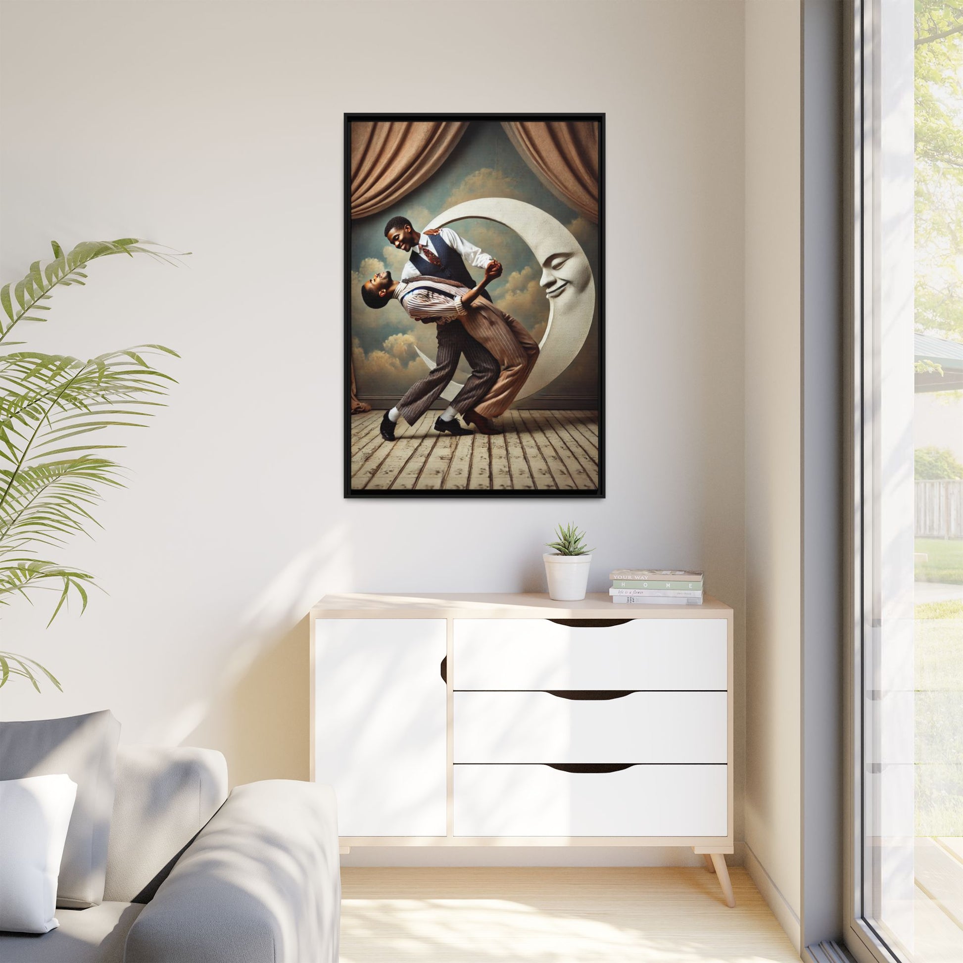 Framed artwork of two Black men in vintage suits dancing tenderly beneath a crescent moon with a smiling face. A romantic 1920s-inspired scene with velvet curtains and a painted sky backdrop. Part of a collection reclaiming lost queer Black history and art.