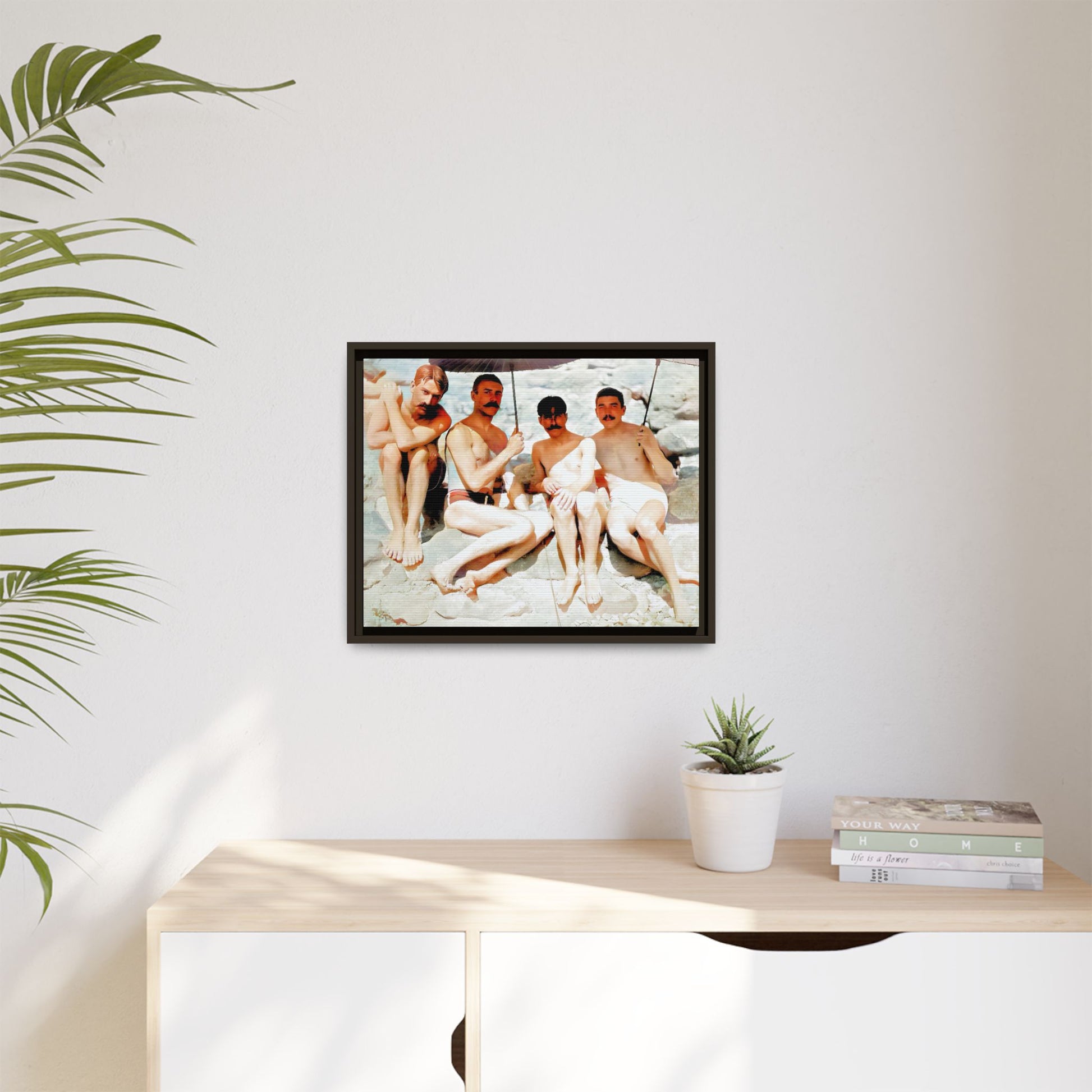A nostalgic vintage beach photograph from Herring Cove Beach, Provincetown, MA. This framed canvas print captures four men in a relaxed summer moment, perfect for coastal home decor or as an LGBTQ+ history tribute.