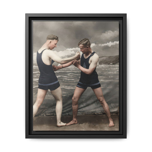 Restored vintage photograph of two men in bathing suits before a painted seascape backdrop