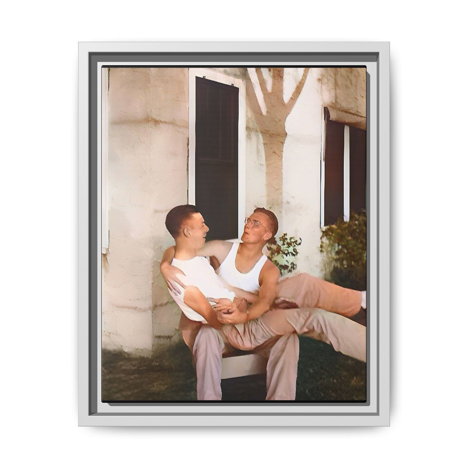 A vintage photograph of Donald and Joseph, two men embracing with joy in 1930s New Orleans. Captured in warm sunlight against a rustic Louisiana home, this intimate portrait celebrates LGBTQ+ history, love, and the beauty of unspoken connection. Gay Couple