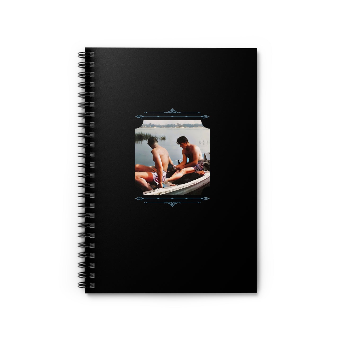 Vintage spiral notebook with a photo of two men sitting in a boat, sharing a quiet lakeside moment.