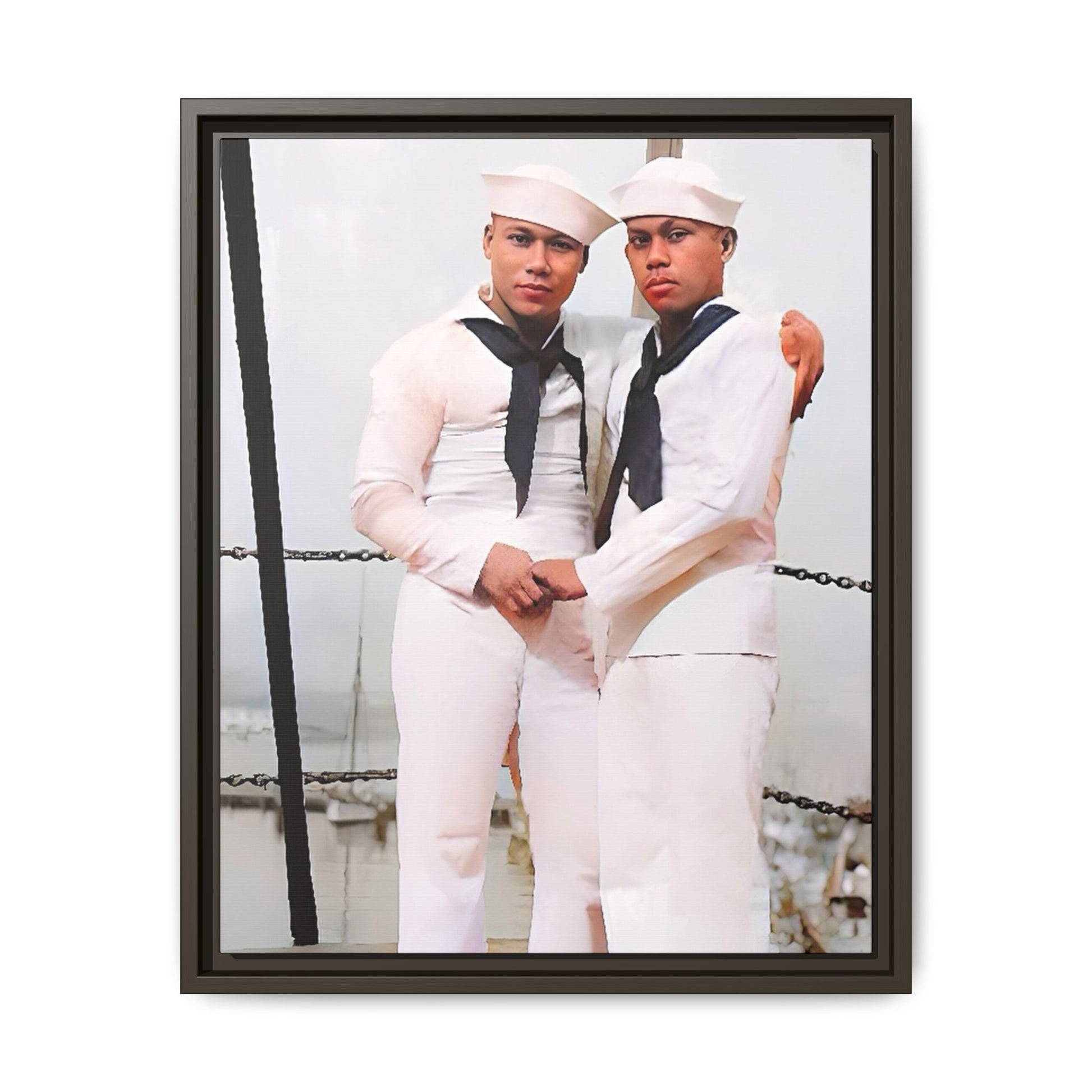 A restored vintage photograph of two Navy sailors standing together aboard a naval ship at Apra Harbor, Guam. Dressed in crisp white uniforms, their hands gently clasped, the image captures a quiet moment of strength, devotion, and LGBTQ+ military history.