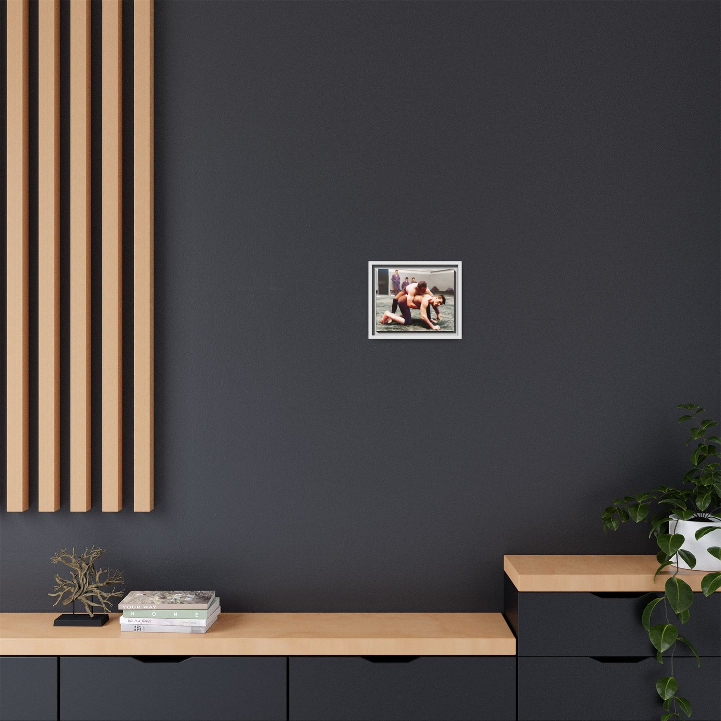 A framed vintage wrestling photograph on matte canvas featuring a Victorian-era match at Love’s Wrestling Club in Plumstead, UK, capturing strength and camaraderie.