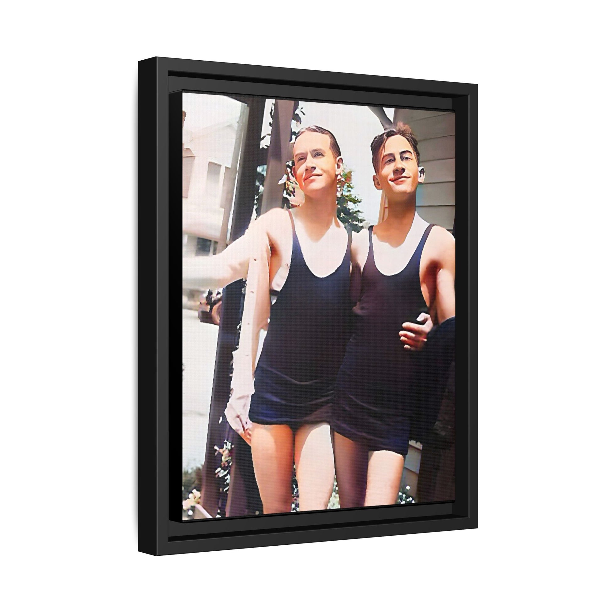 A beautifully restored vintage beach photo of two friends, Lee and Clifford, in classic black swimsuits, walking along Ocean Grove, New Jersey. Their smiles and relaxed body language capture the carefree joy of 1920s summer days, set against a charming coastal backdrop. Gay Couple