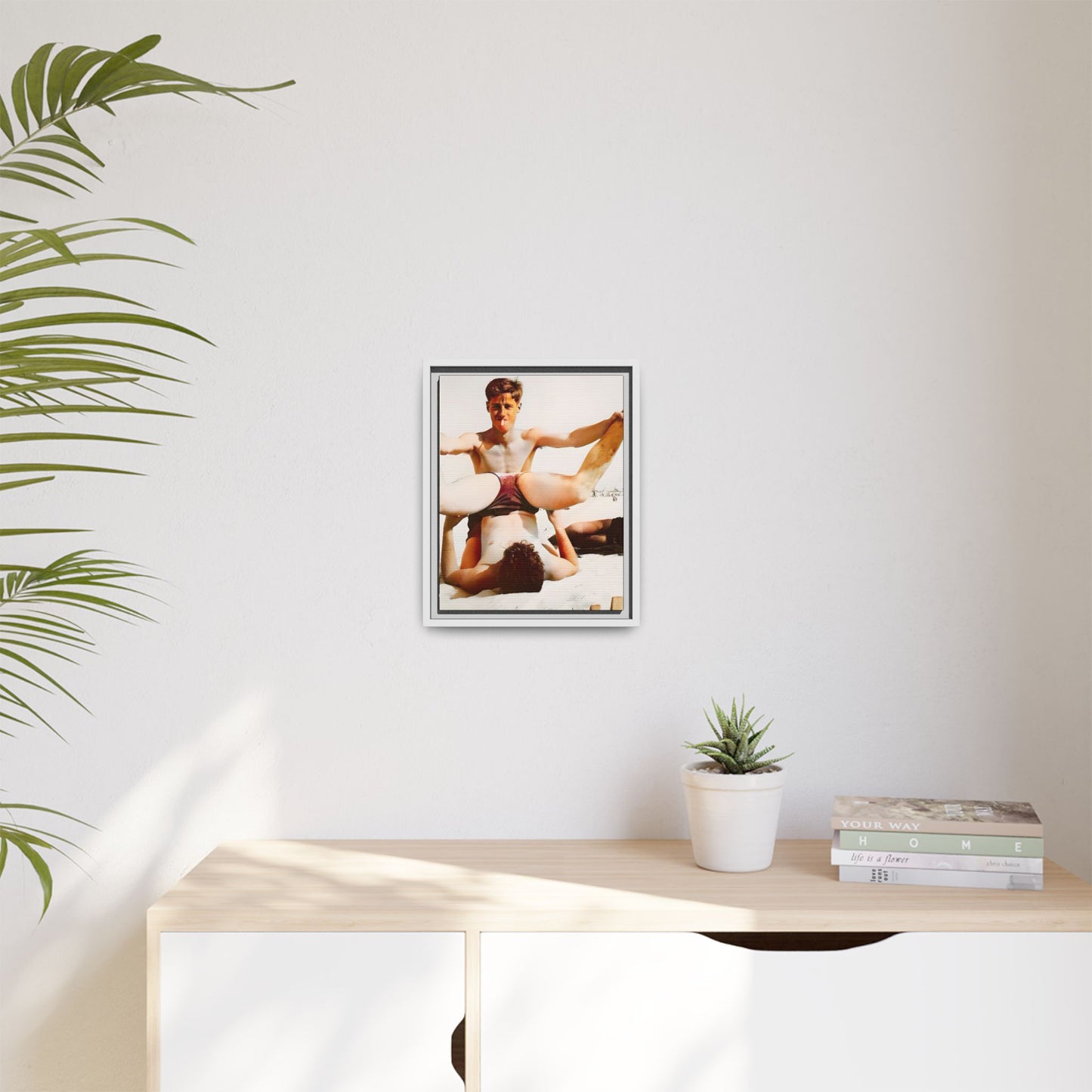 Restored mid-20th century photo of Mitch and Sam at 12th Street Beach, Miami, sharing a playful moment of love and joy, framed as wall décor.