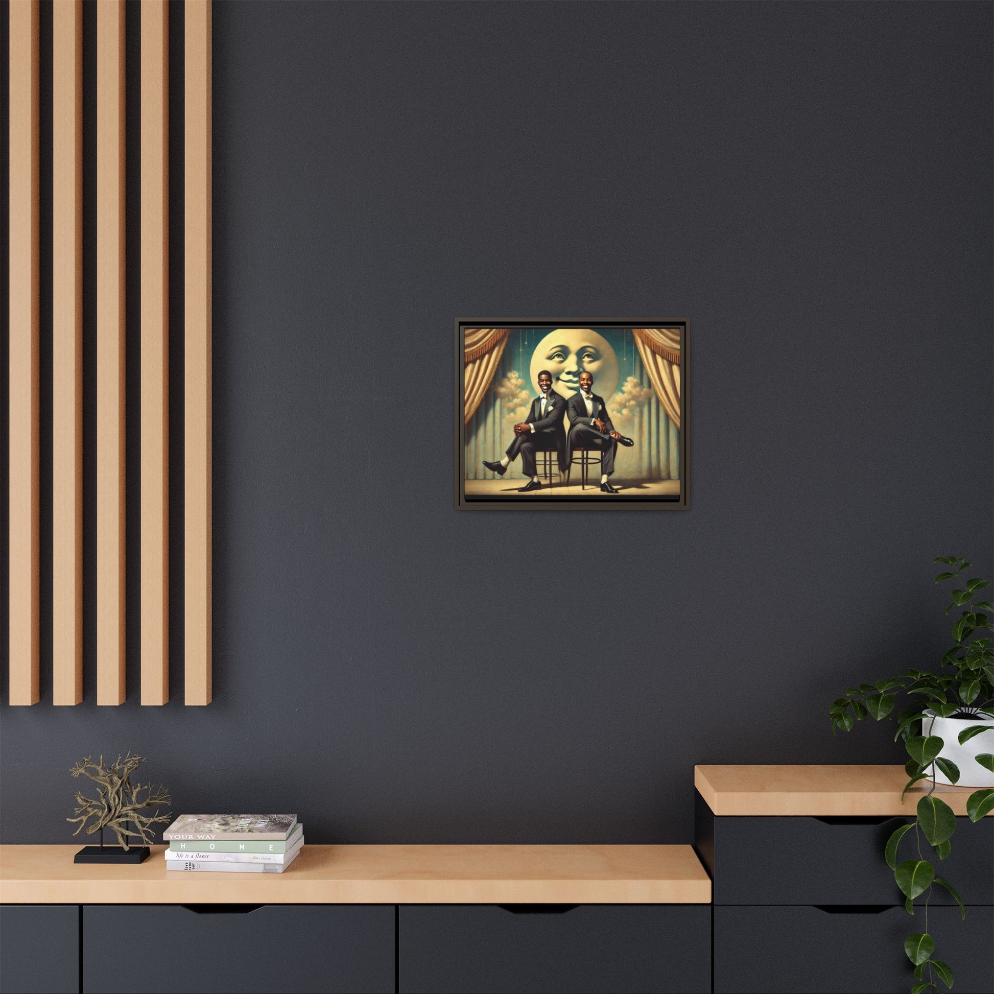 Framed vintage-style portrait of two Black men in tuxedos seated under a smiling crescent moon prop with golden curtains and cloud backdrop. This restored matte canvas honors lost LGBTQ history and reclaims early 20th-century queer representation with pride.