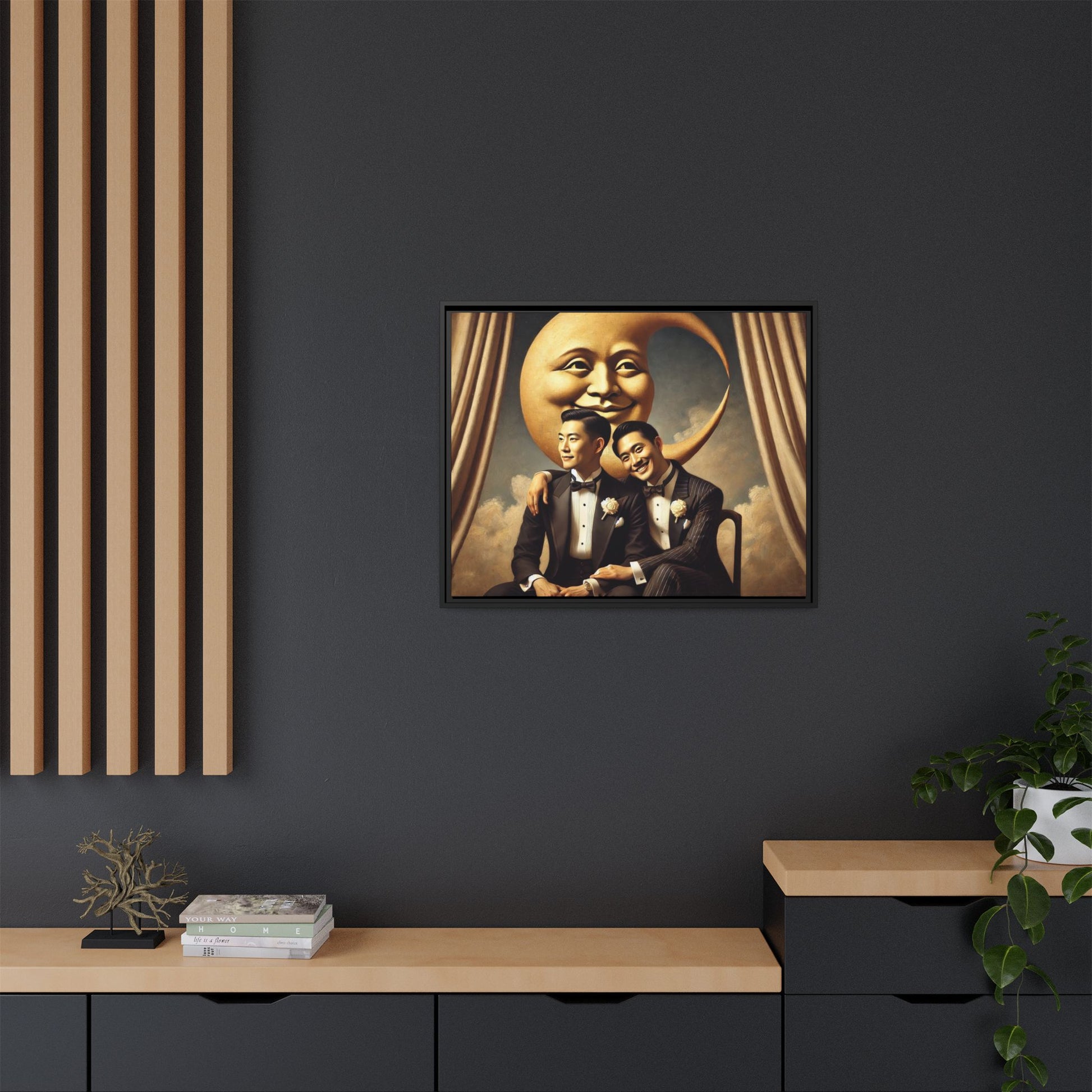 Vintage-inspired artwork of a romantic gay Asian couple in tuxedos sitting affectionately beneath a smiling crescent moon prop, surrounded by vintage stage curtains and dreamy clouds. A reclaimed queer narrative from the Man In The Moon series.