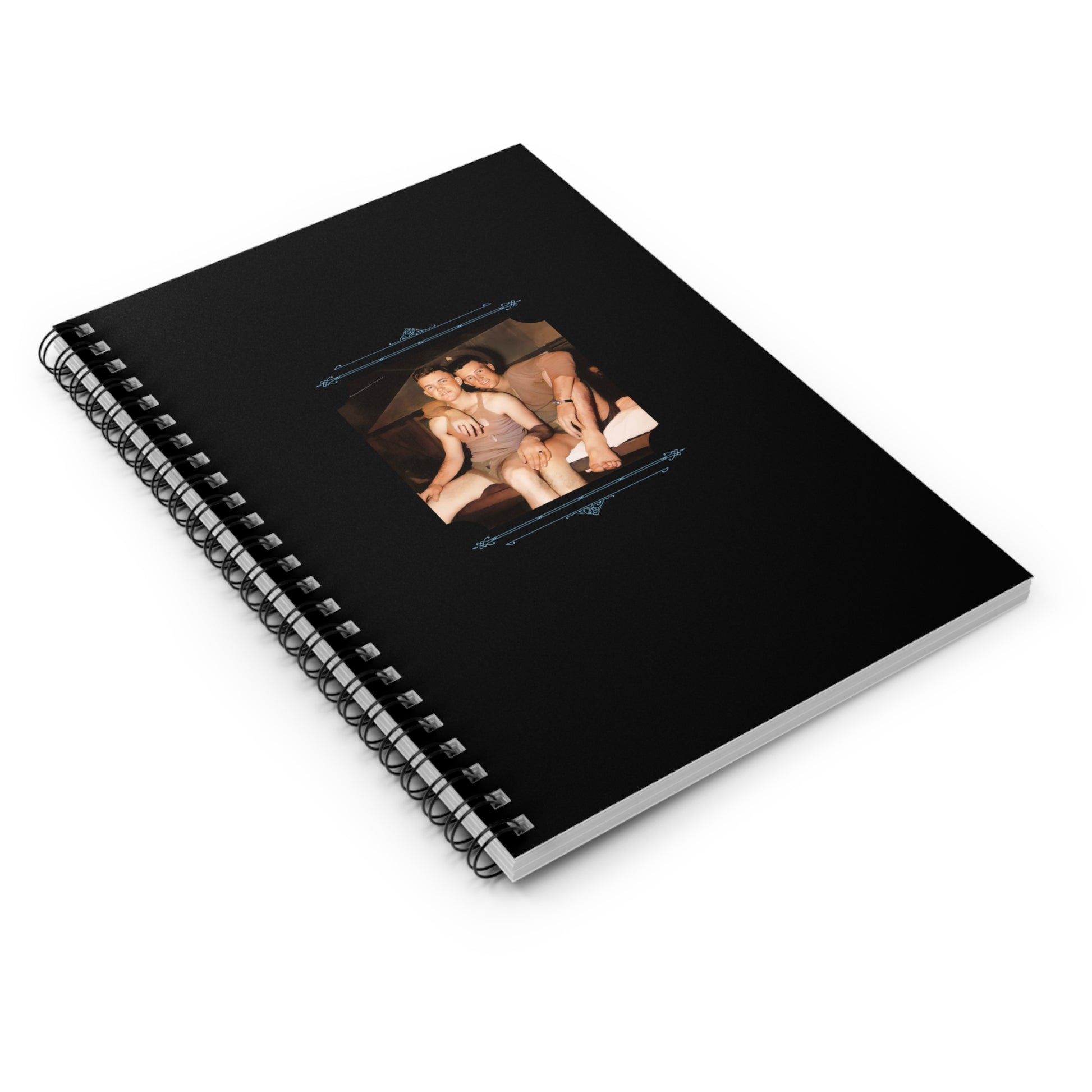 Black spiral notebook featuring a restored WWII-era photo of two young soldiers sharing a tender moment in barracks